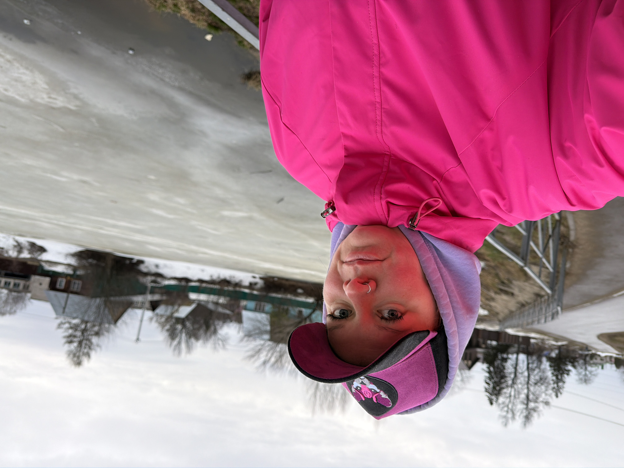 Woman poses by frozen lake in Chaikovsky, Russia