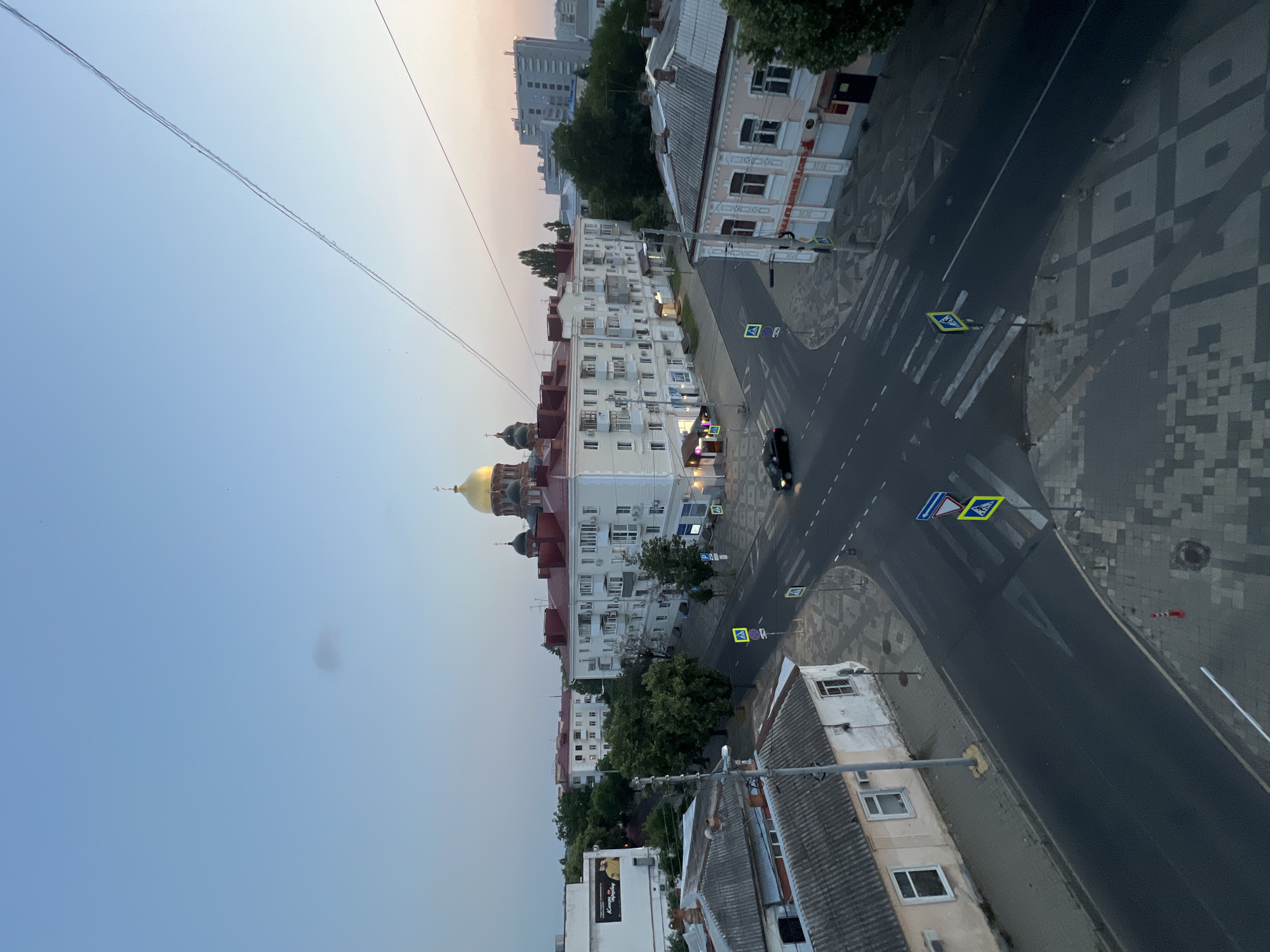 Krasnodar Orthodox church and surrounding intersection at dusk