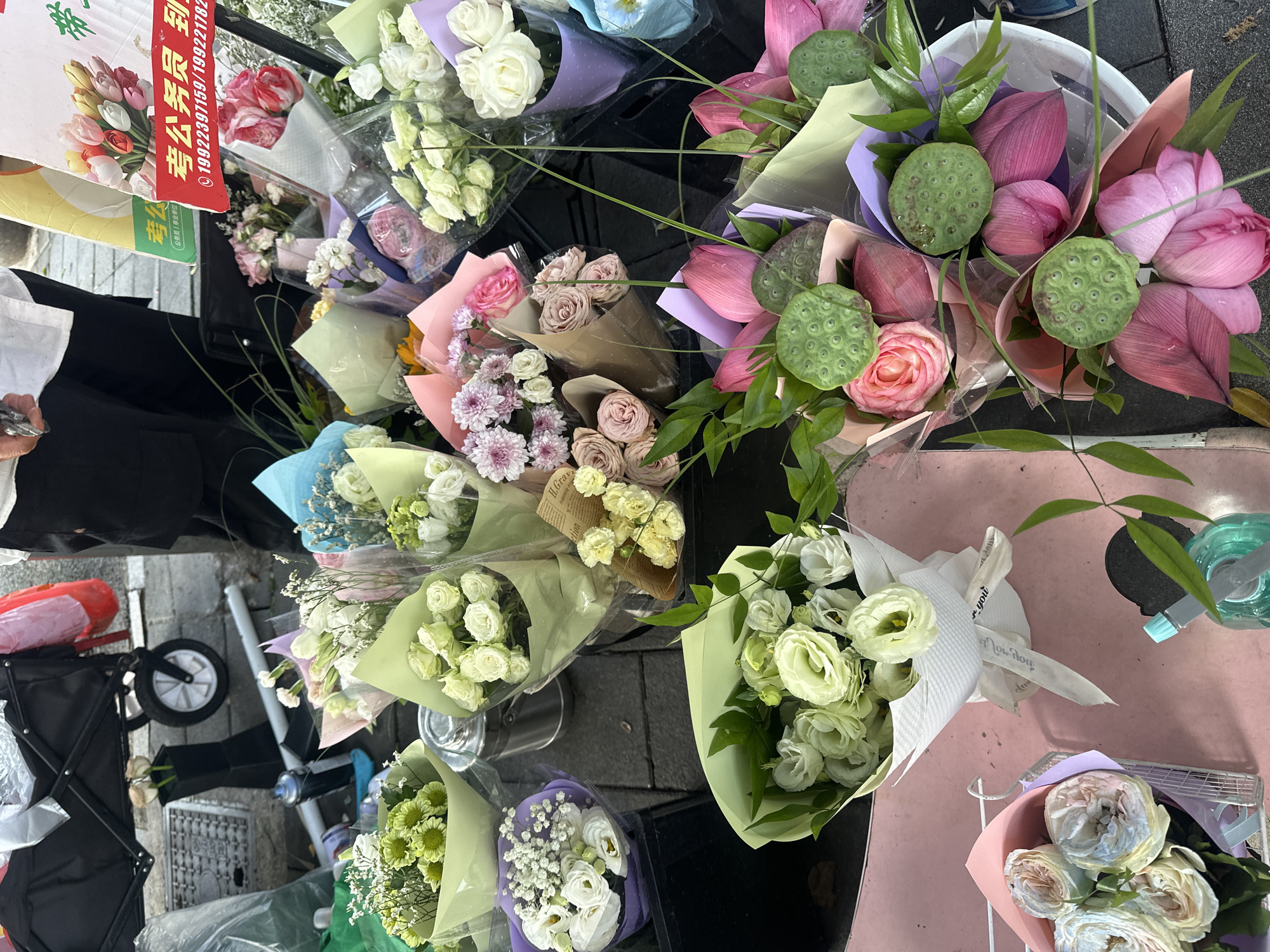 Street vendors and flower stalls on a Chongqing sidewalk
