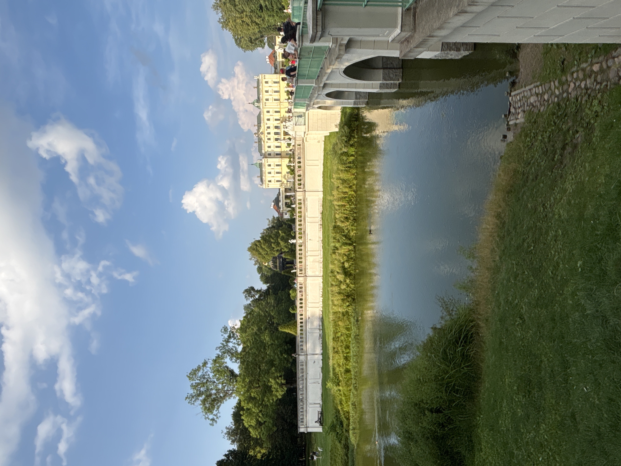 Branicki Palace gardens, fountains, and statues on a clear afternoon