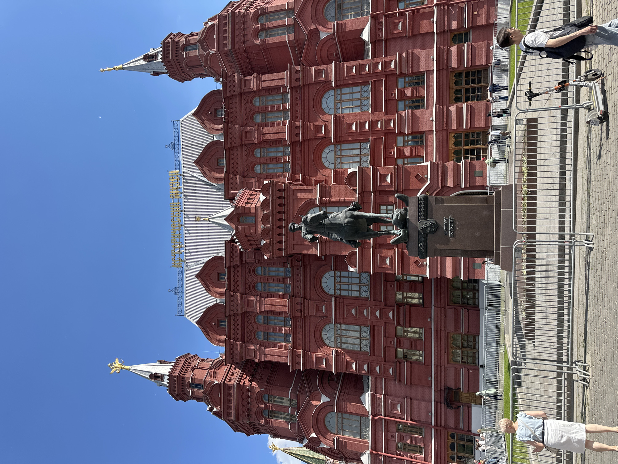 Family visits Red Square on sunny afternoon