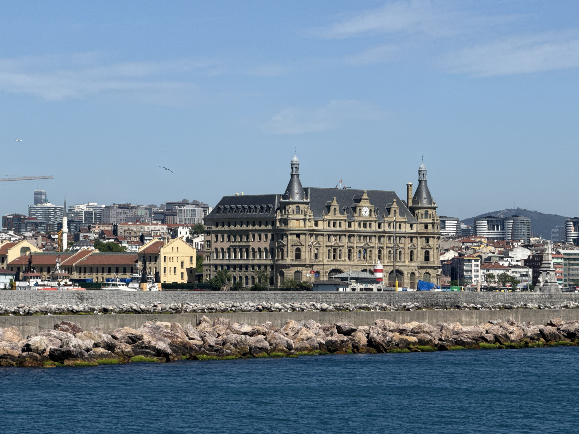 Ferry passengers document Haydarpaşa Terminal views from Istanbul waters
