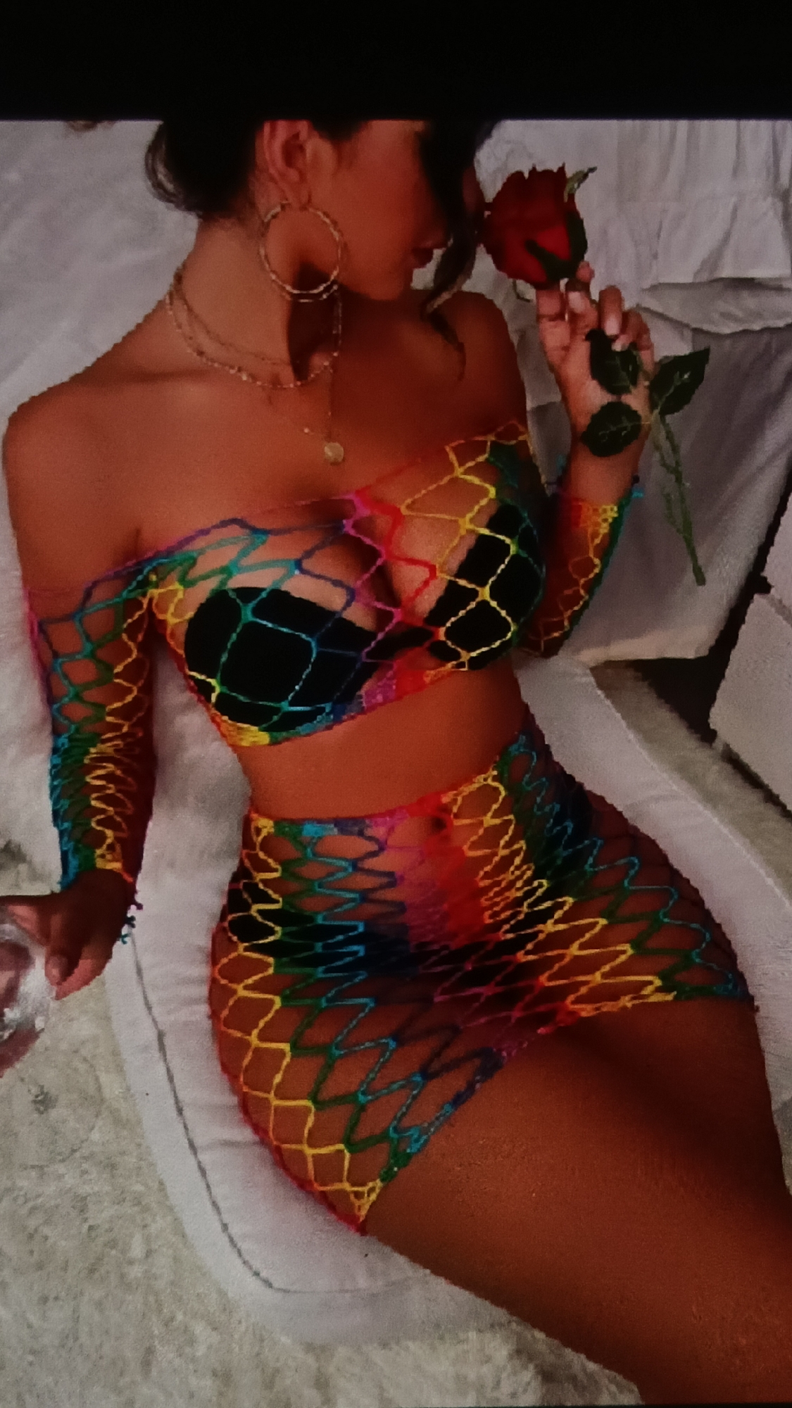 Rainbow fishnet outfit and neon signs in Nha Trang at night