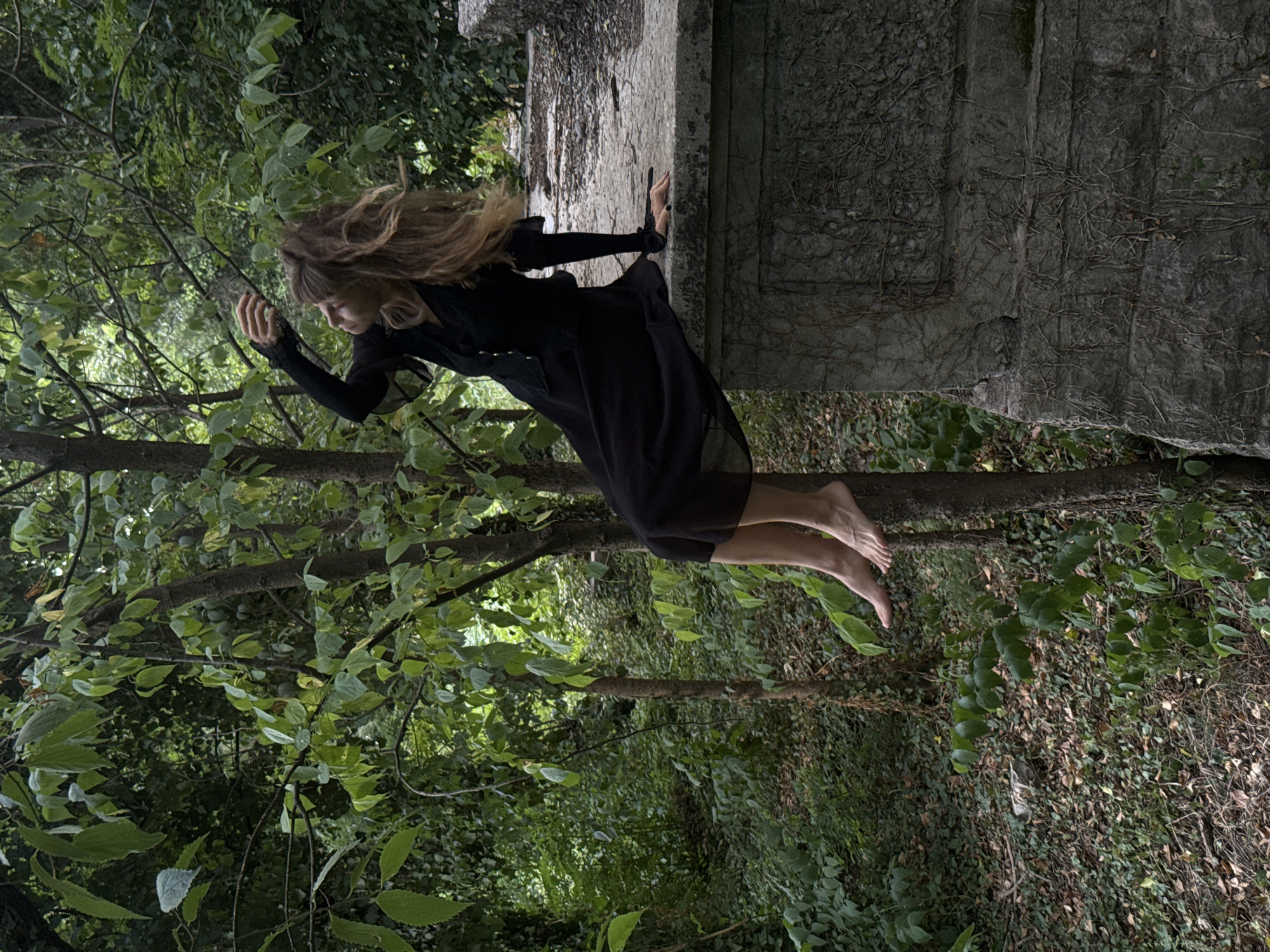 Gothic photo shoot among overgrown tombstones in Podgorica