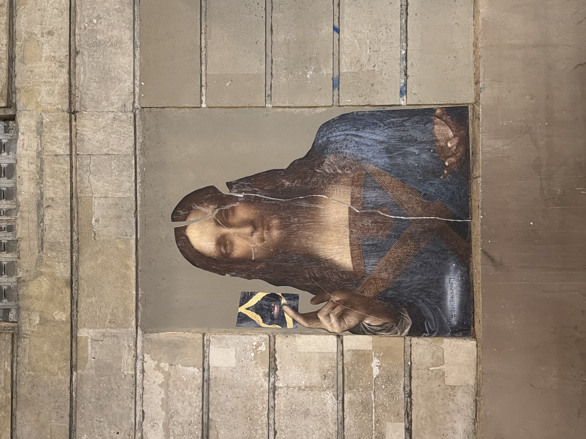 Paris scenes: café gathering and damaged religious artwork documented