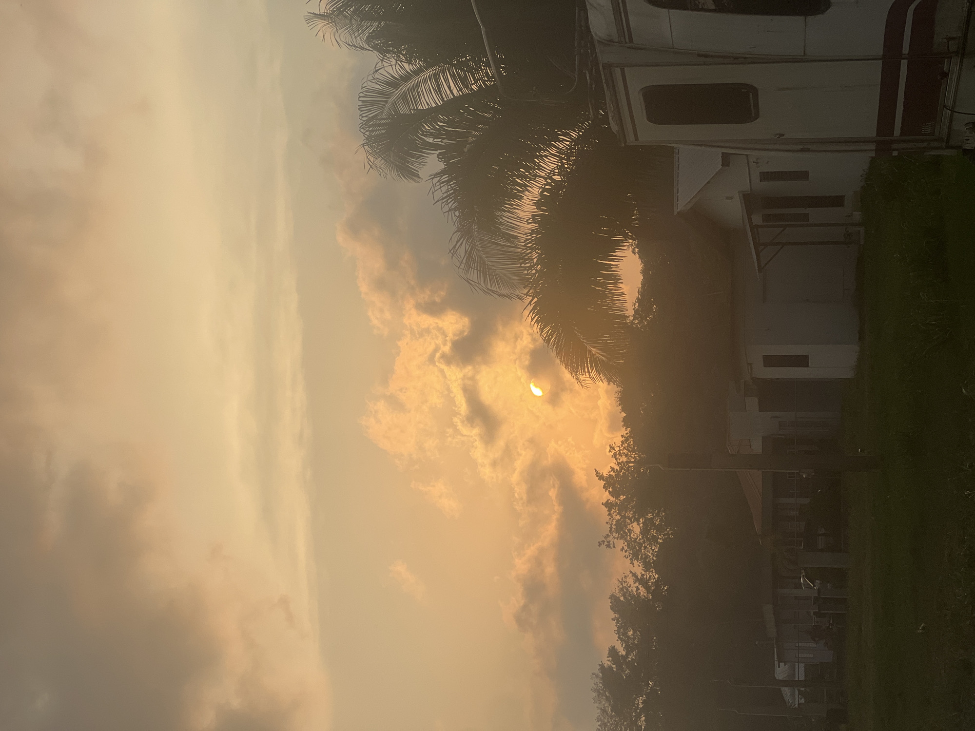 Hazy sunset observed in Punta Gorda Town, Belize