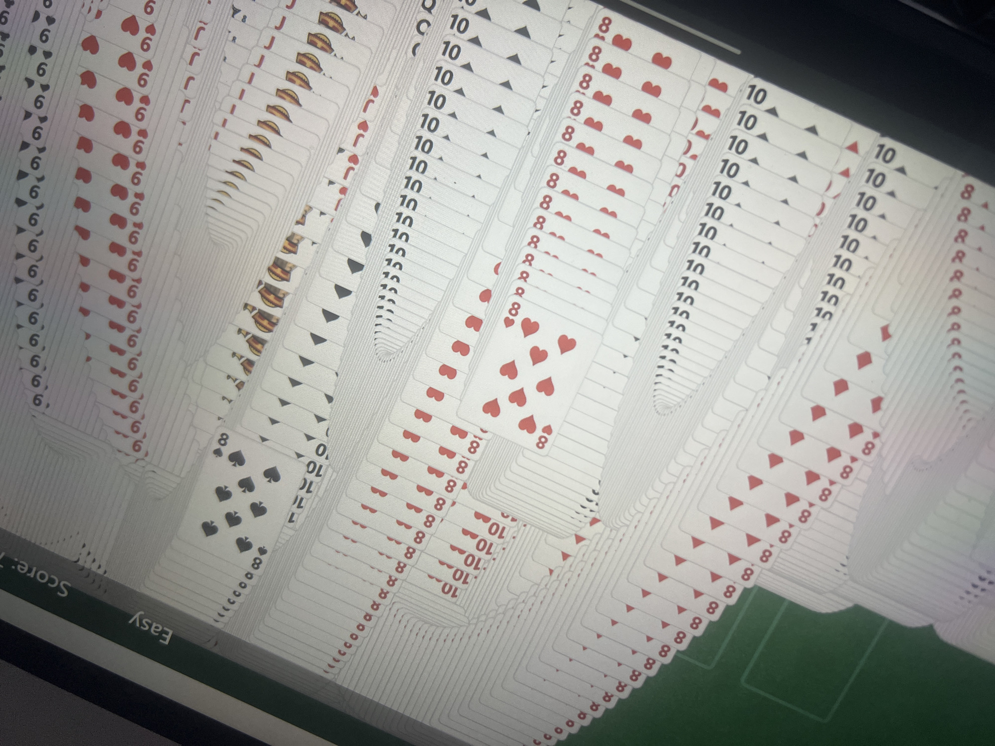 Computer user plays solitaire in Dar es-Salaam evening