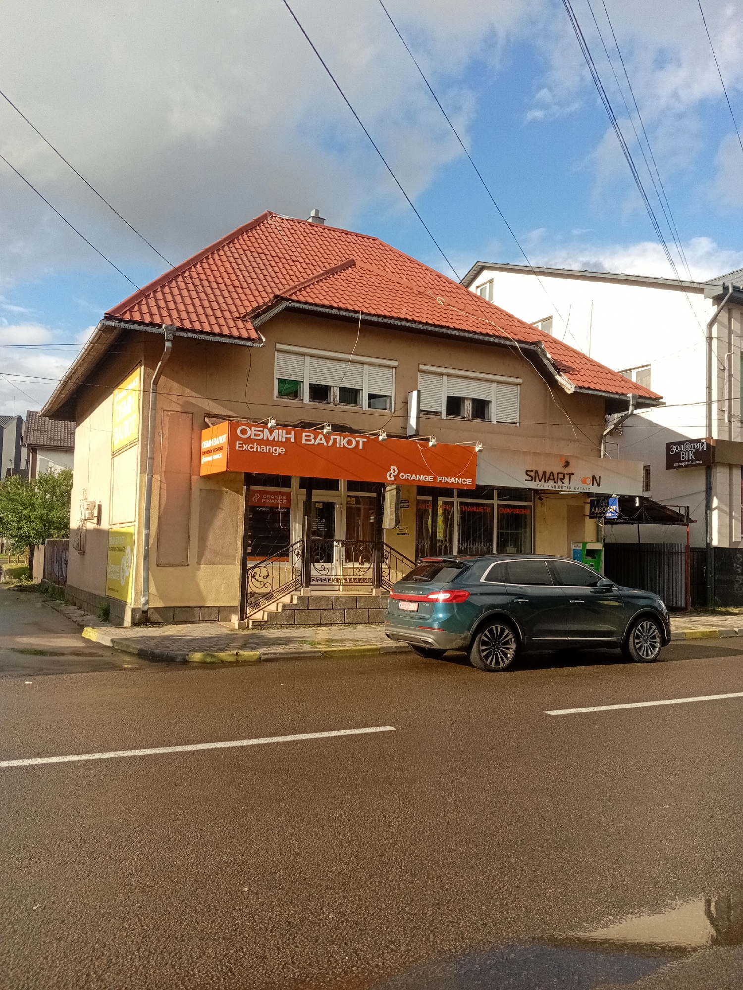 Wet streets and local architecture in Tiachiv, Ukraine