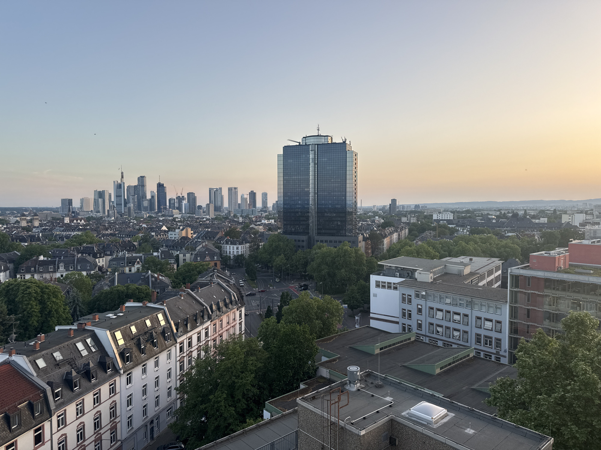 Frankfurt residents document sunset cityscape views across downtown area