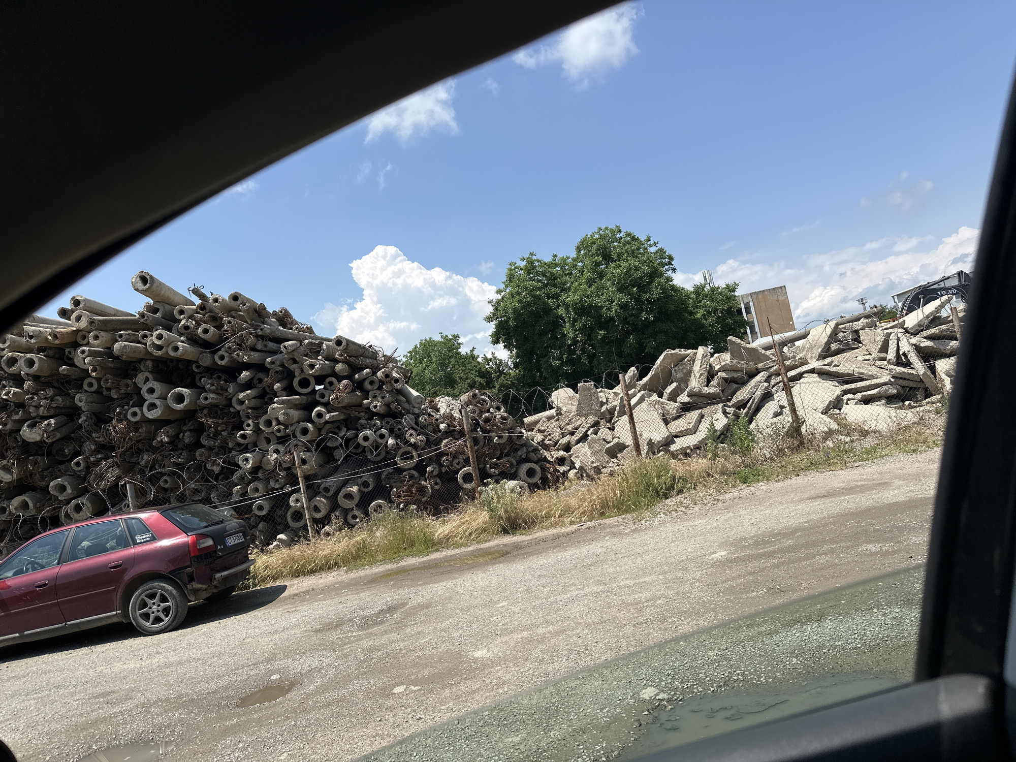 Motorist drives through industrial wasteland area during morning commute