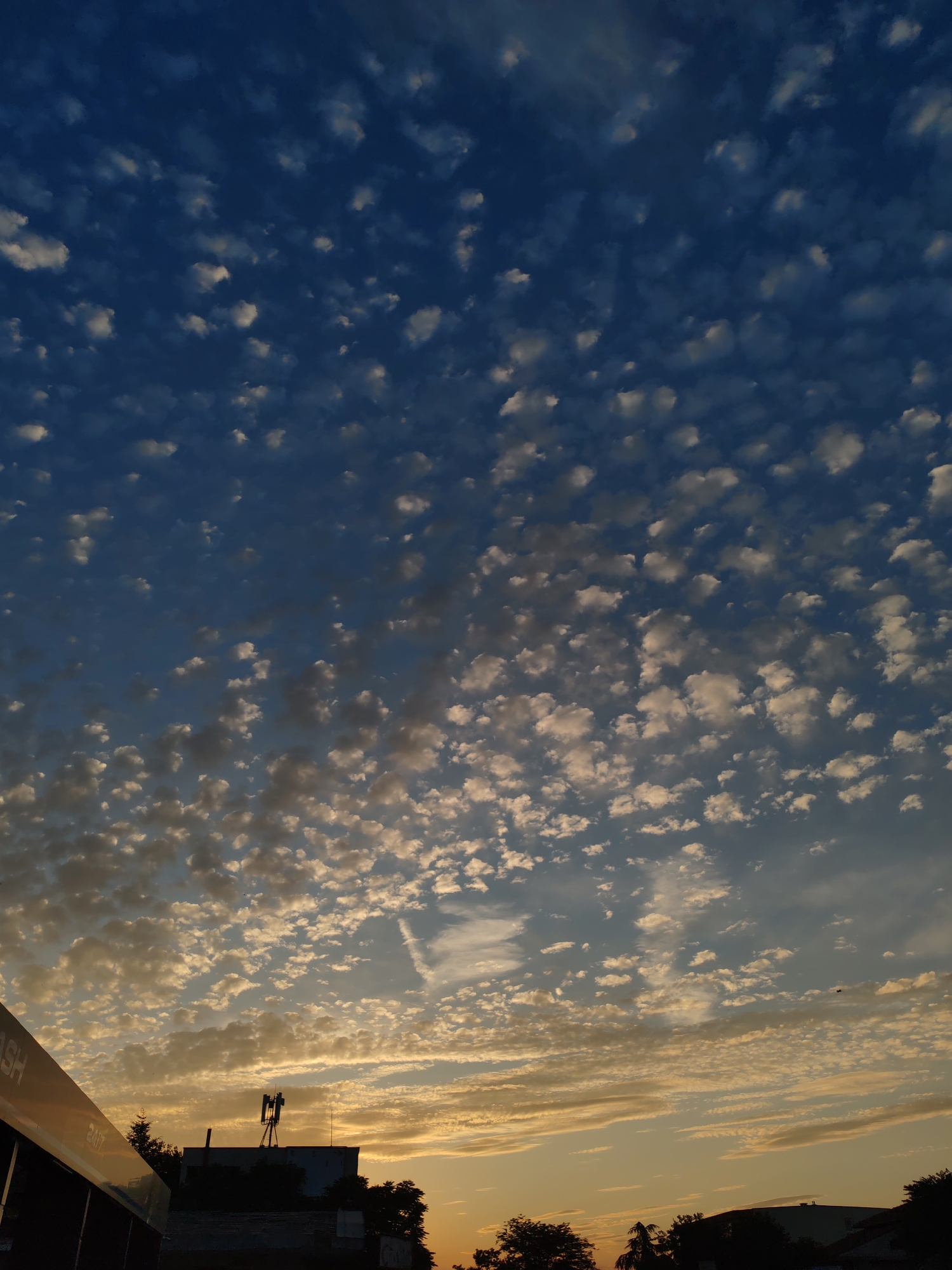 Burgas sunset lights up a cloud-filled evening sky