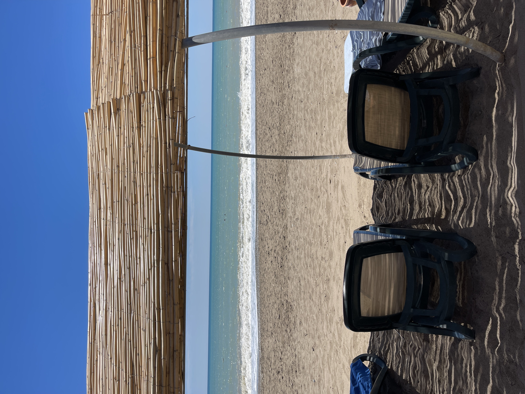 Beach day unfolds in Serik with chairs and refreshments