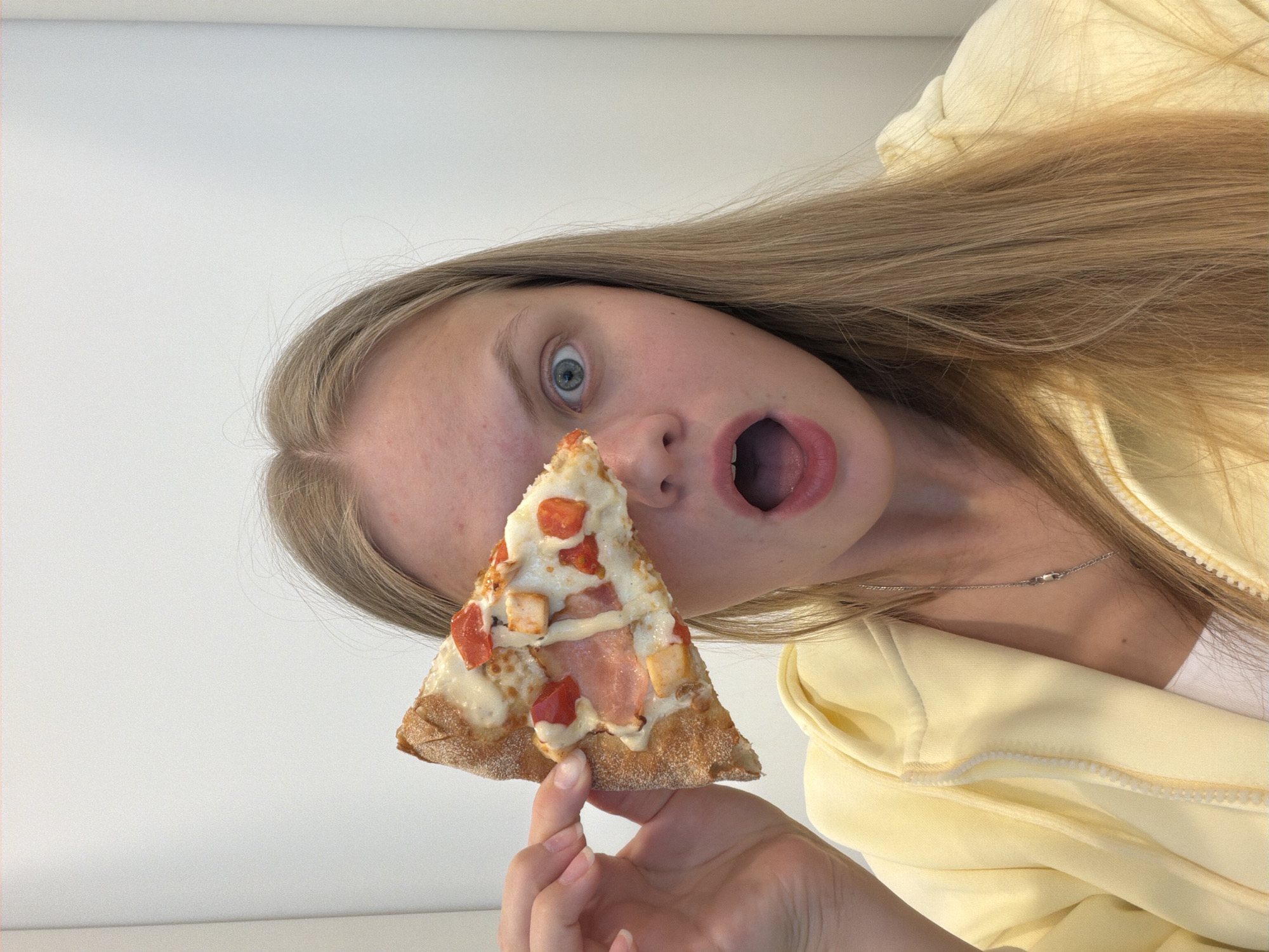 Woman enjoys pizza breakfast in Izhevsk, playful photos captured