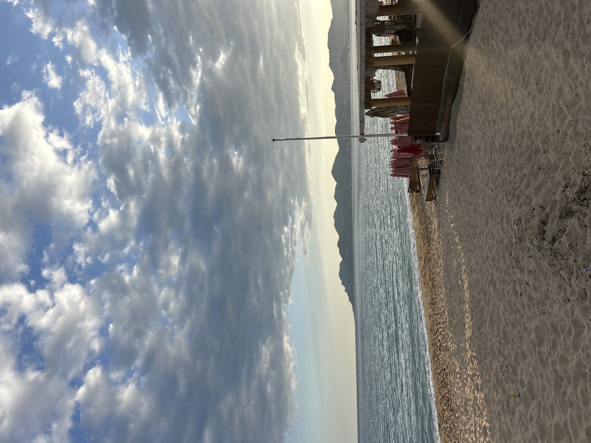 Tourists enjoy typical beach day activities in Cannes waterfront