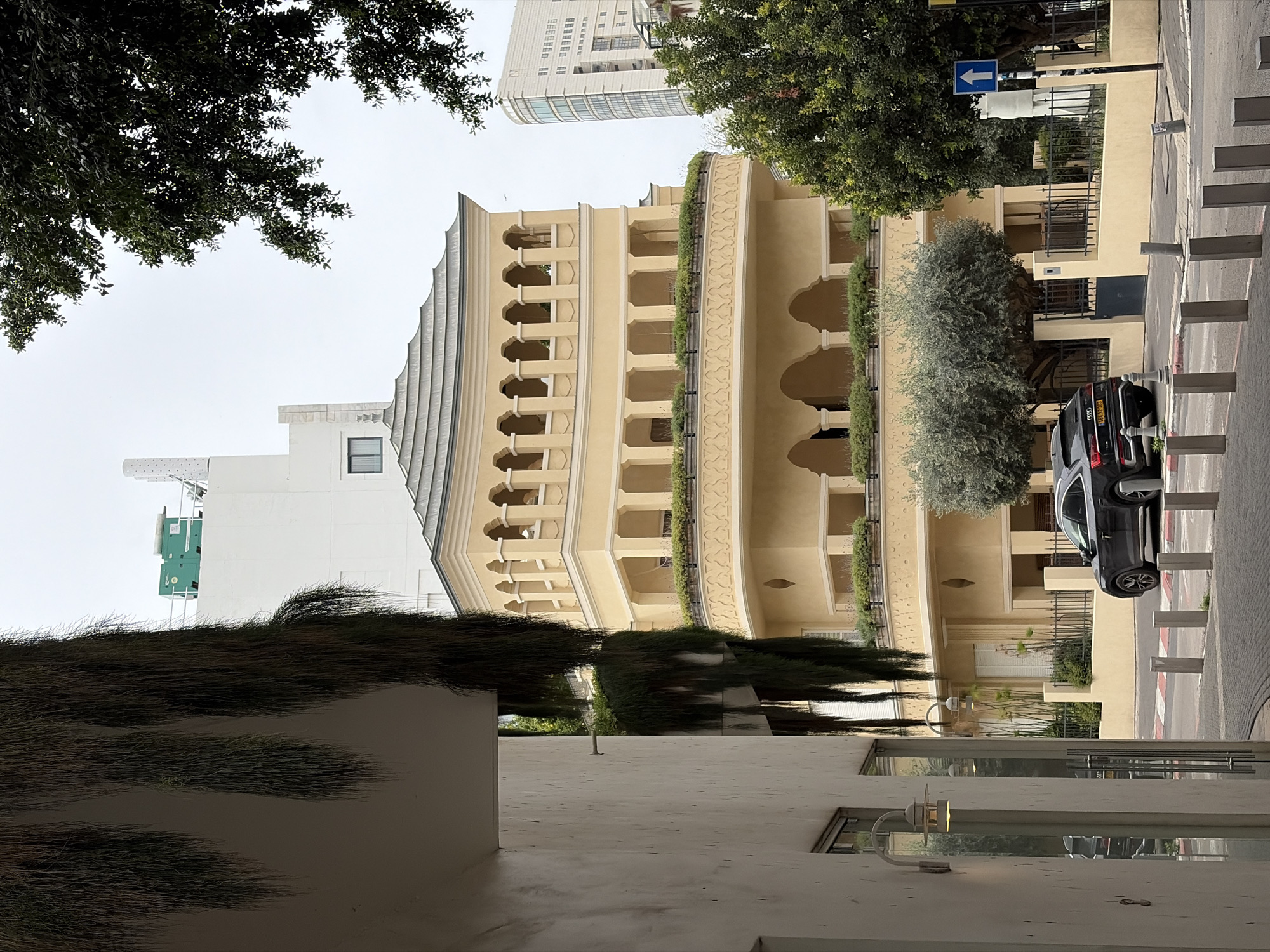Tel Aviv street architecture with green balcony vegetation documented