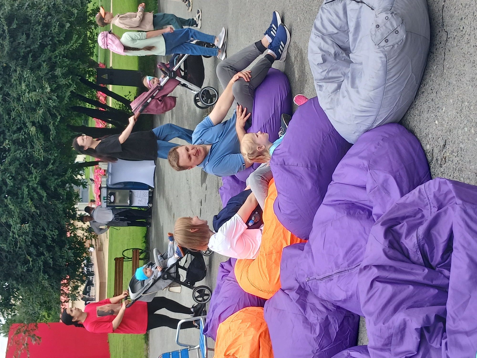Outdoor public event with rides, seating, and mascots in Yekaterinburg