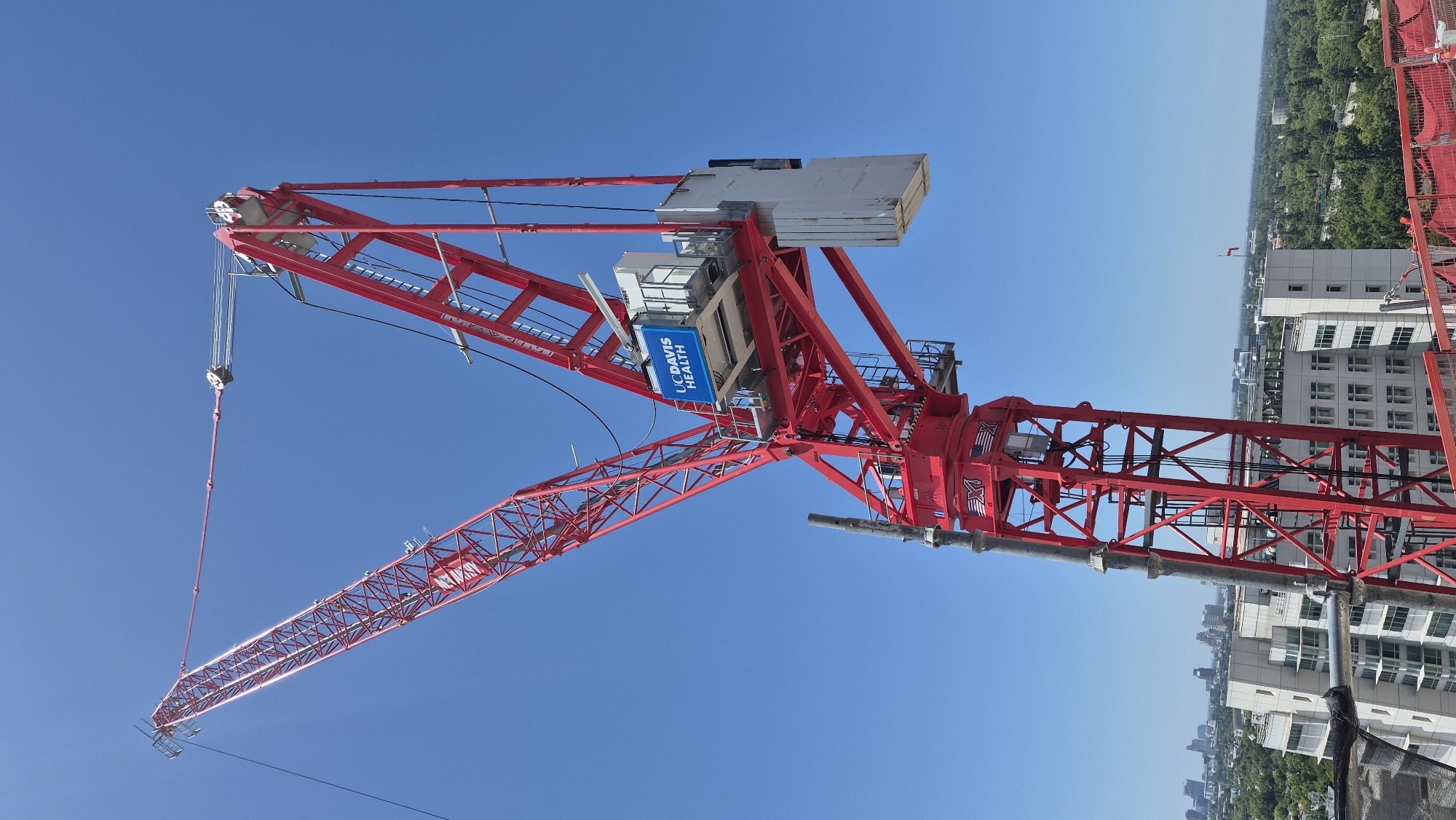 UC Davis Health tower crane rising over Sacramento construction site