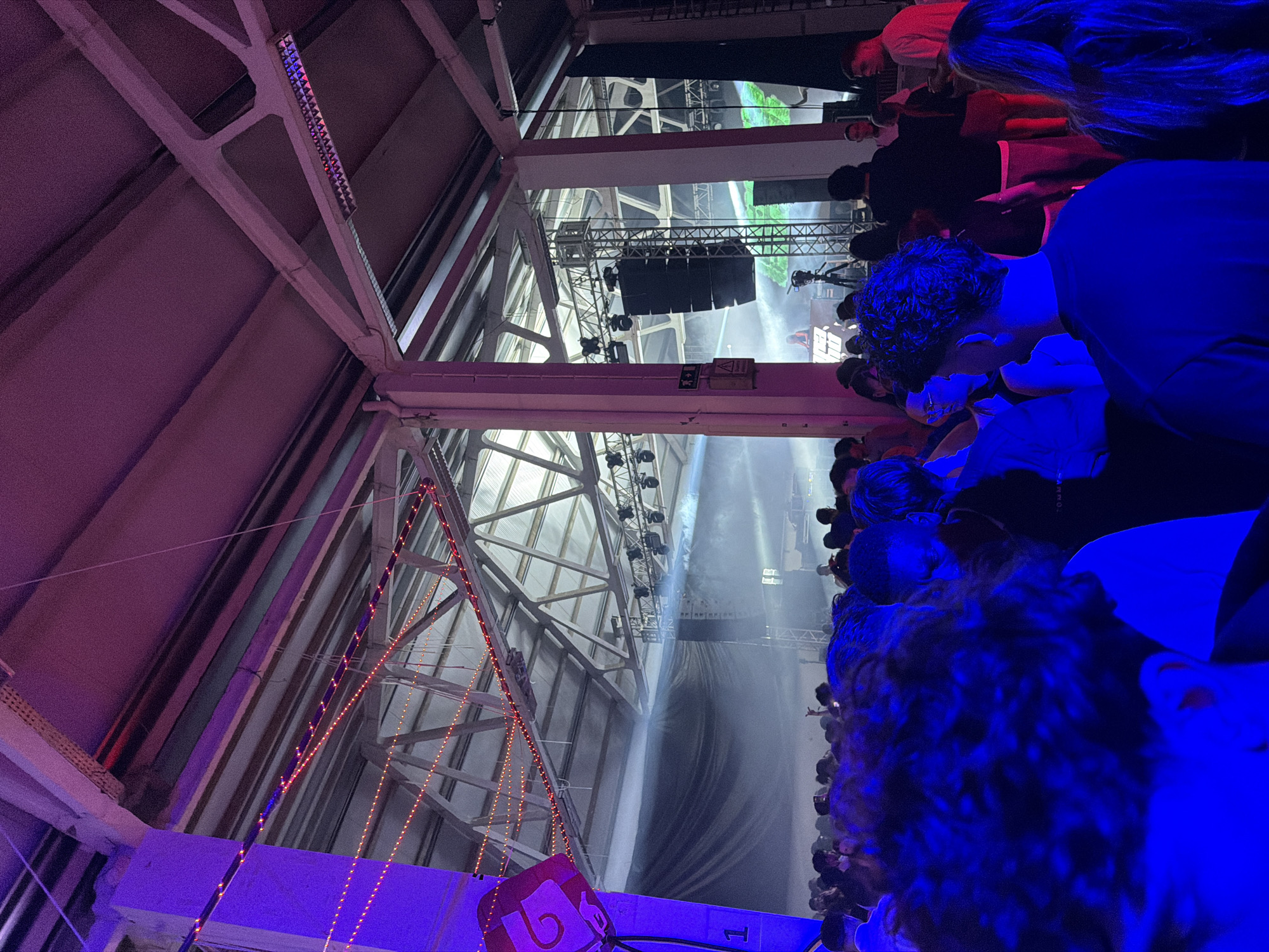 Female DJ performs at packed indoor concert in Bragança