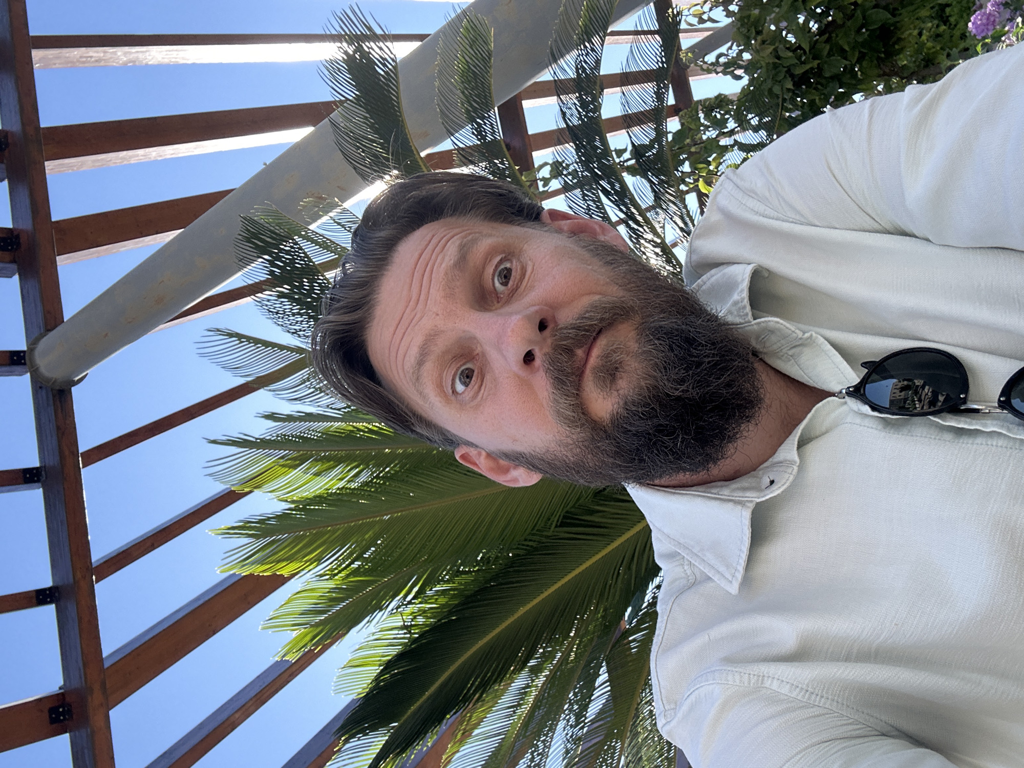 Man explores terraced outdoor venue in sunny Fethiye, Turkey