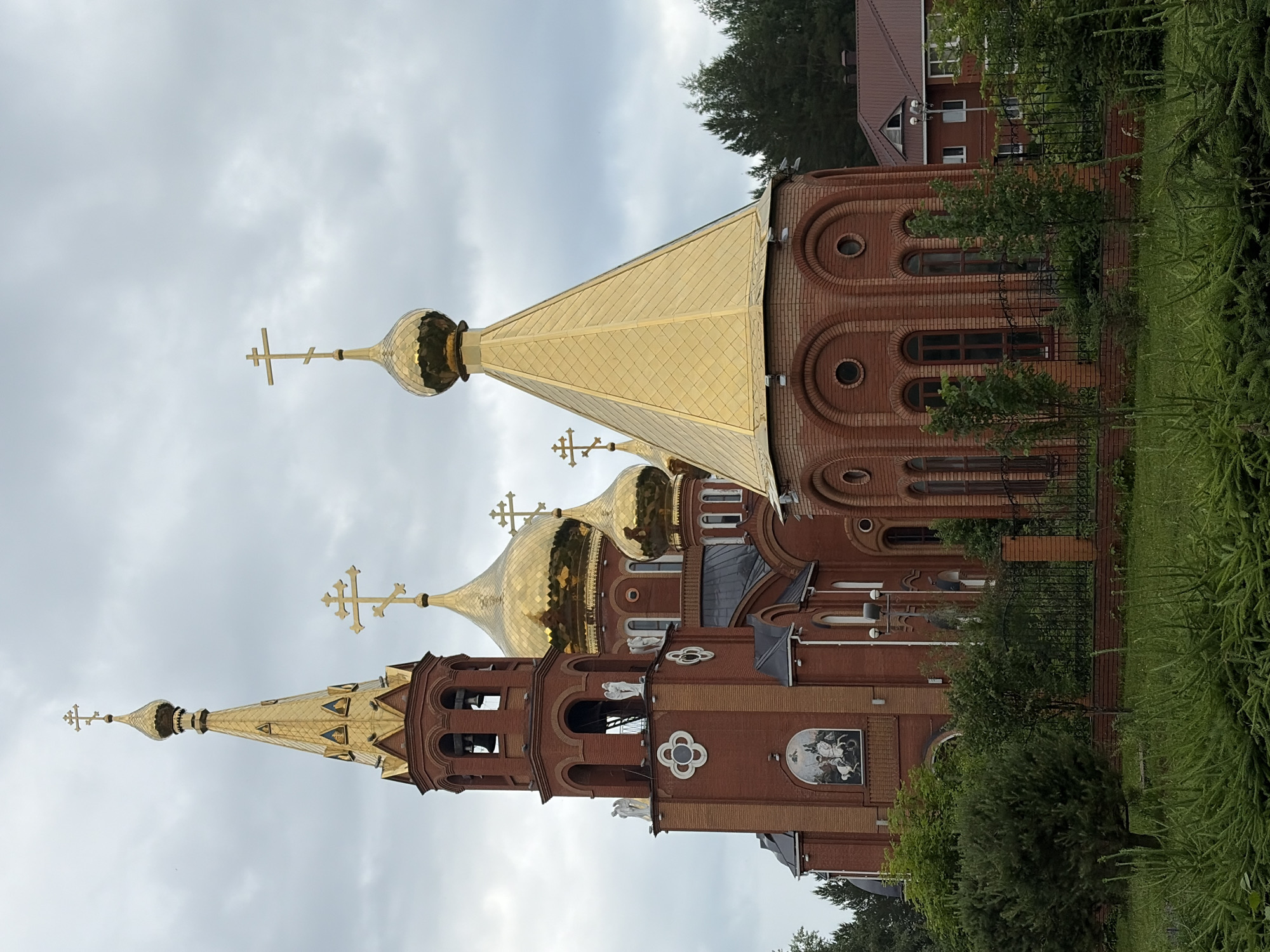 Orthodox church with golden domes observed by witness