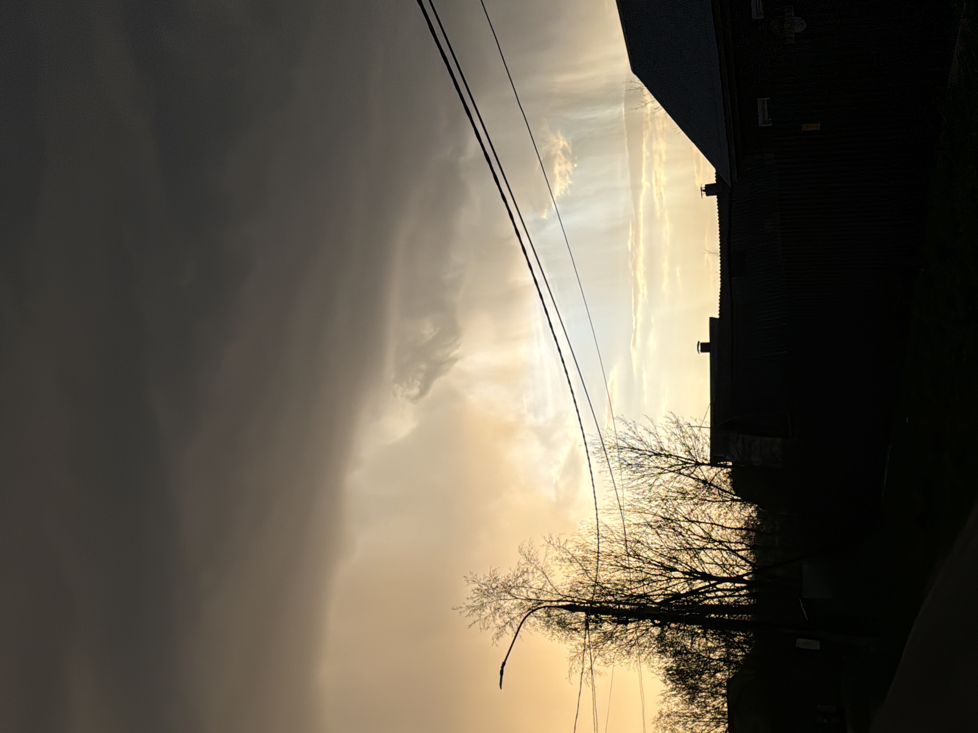 Dramatic Storm-to-Sunset Sky Transition Witnessed in Residential Area
