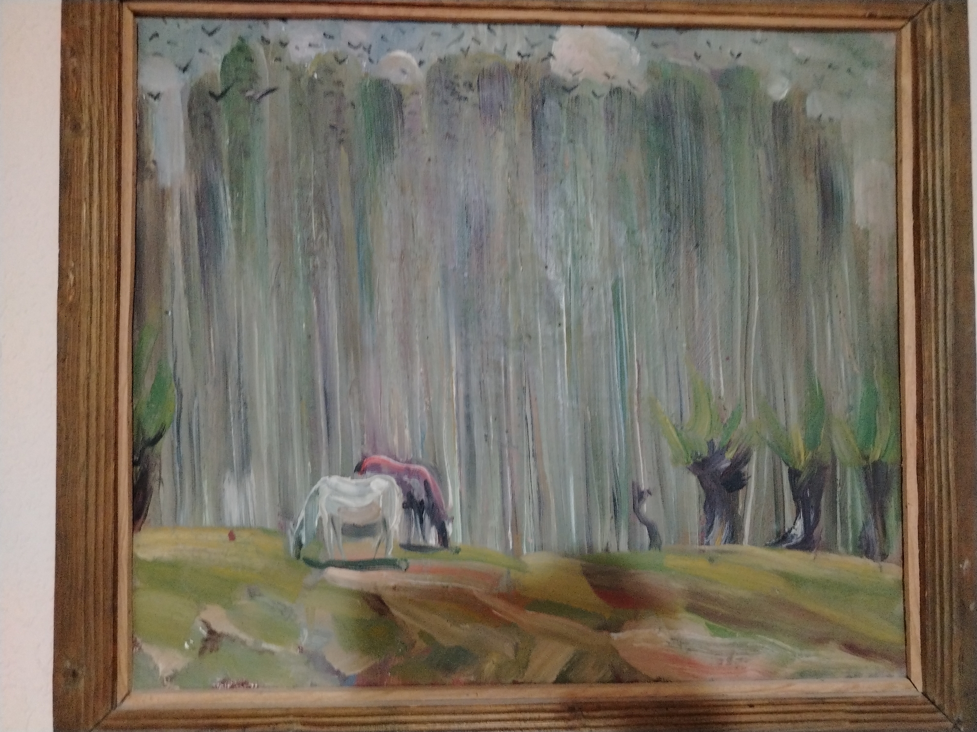 Oil paintings and an aquarium inside a Nukus home