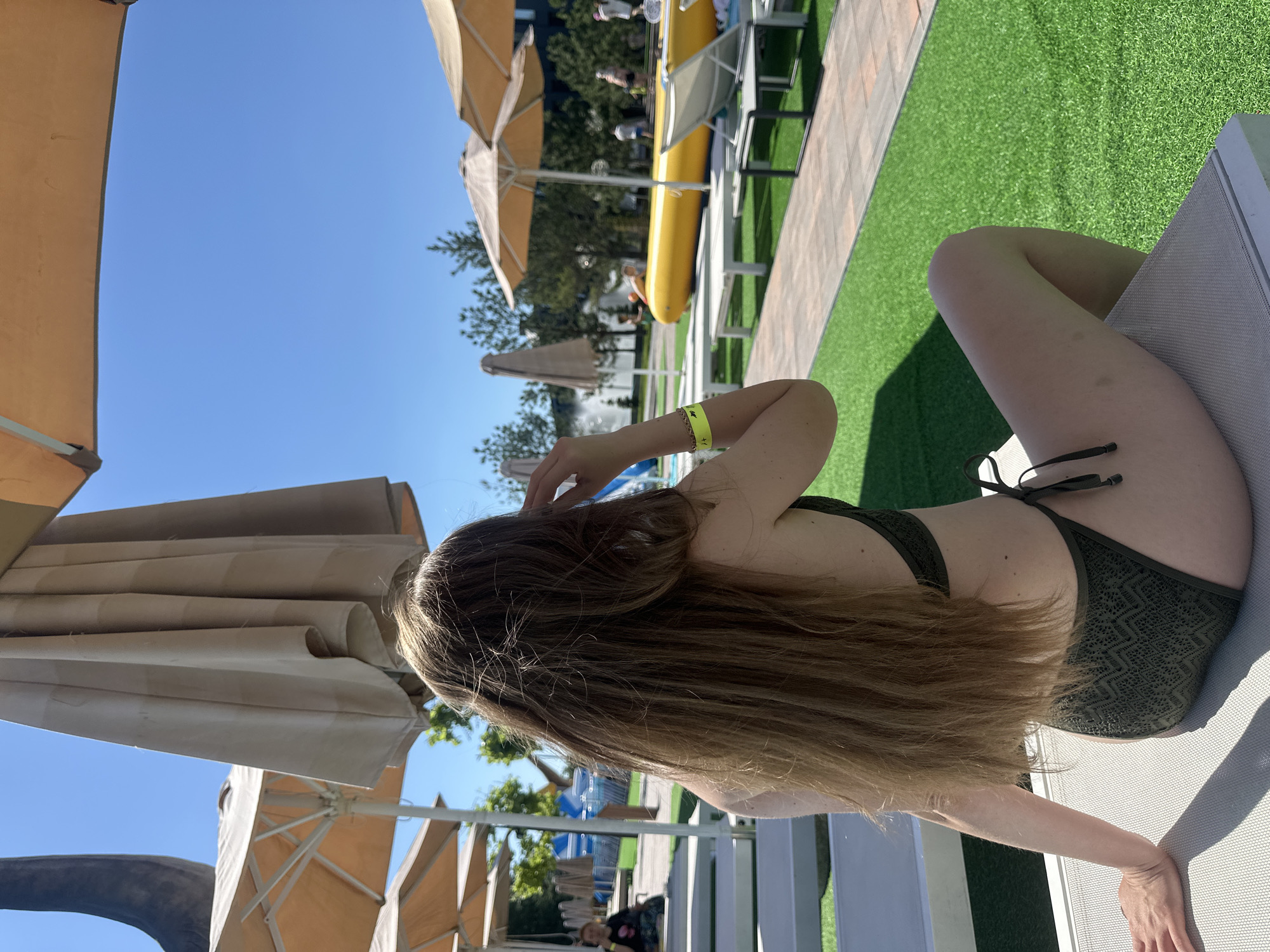 Sunny day at a Khotianivka water park with inflatables and loungers