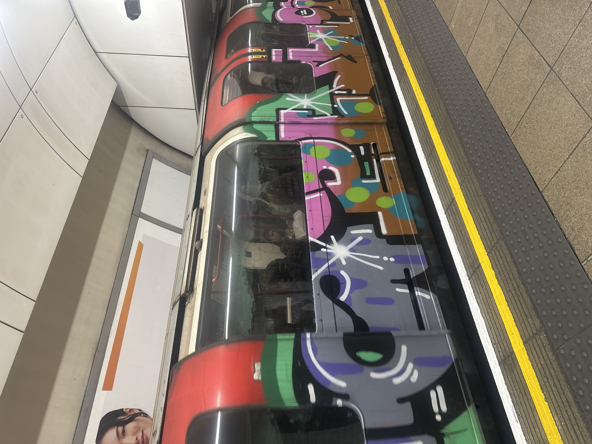 Graffiti-covered London Underground train spotted at station