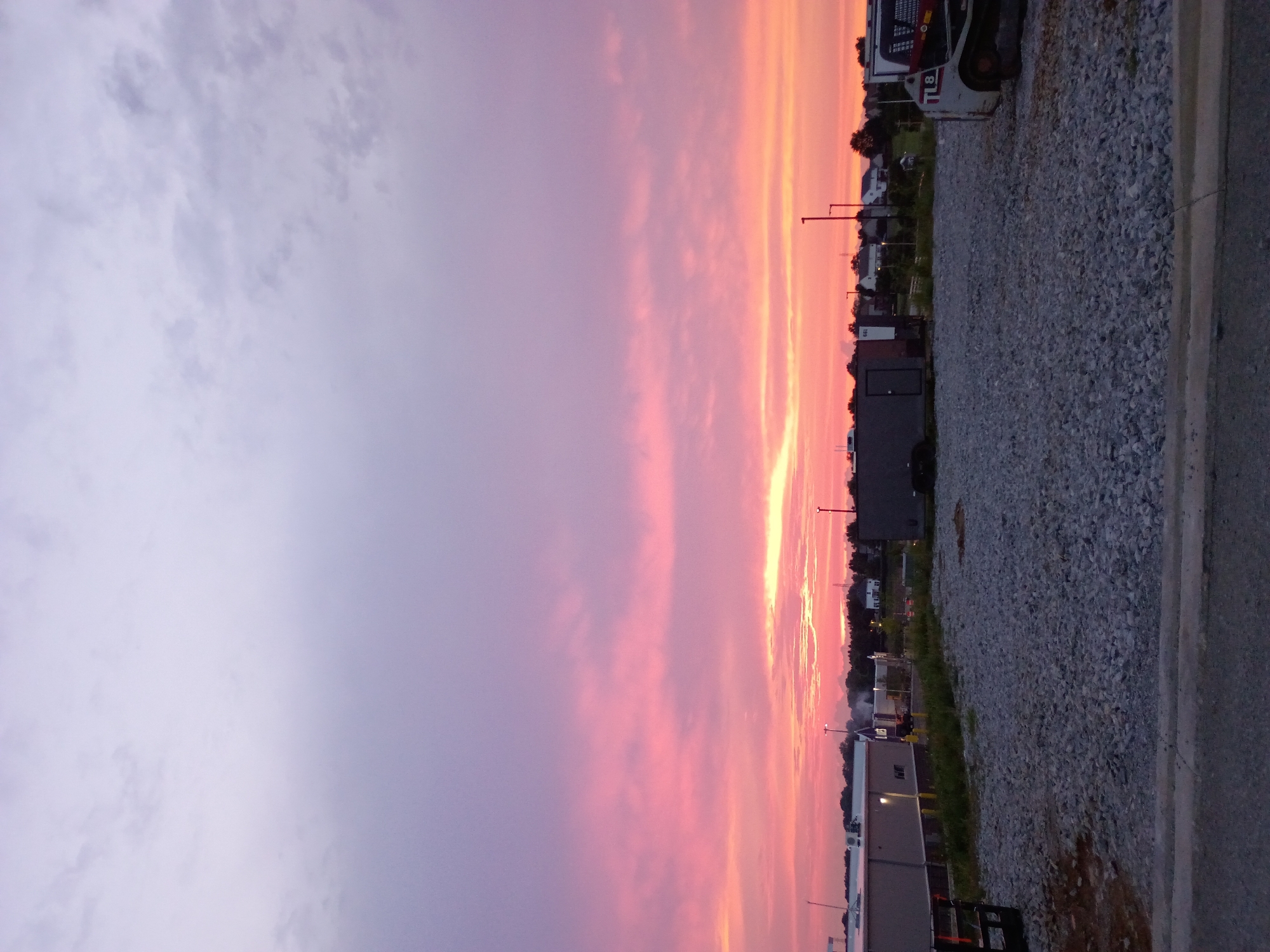 Colorful sunset over Nicholasville suburbs and construction site