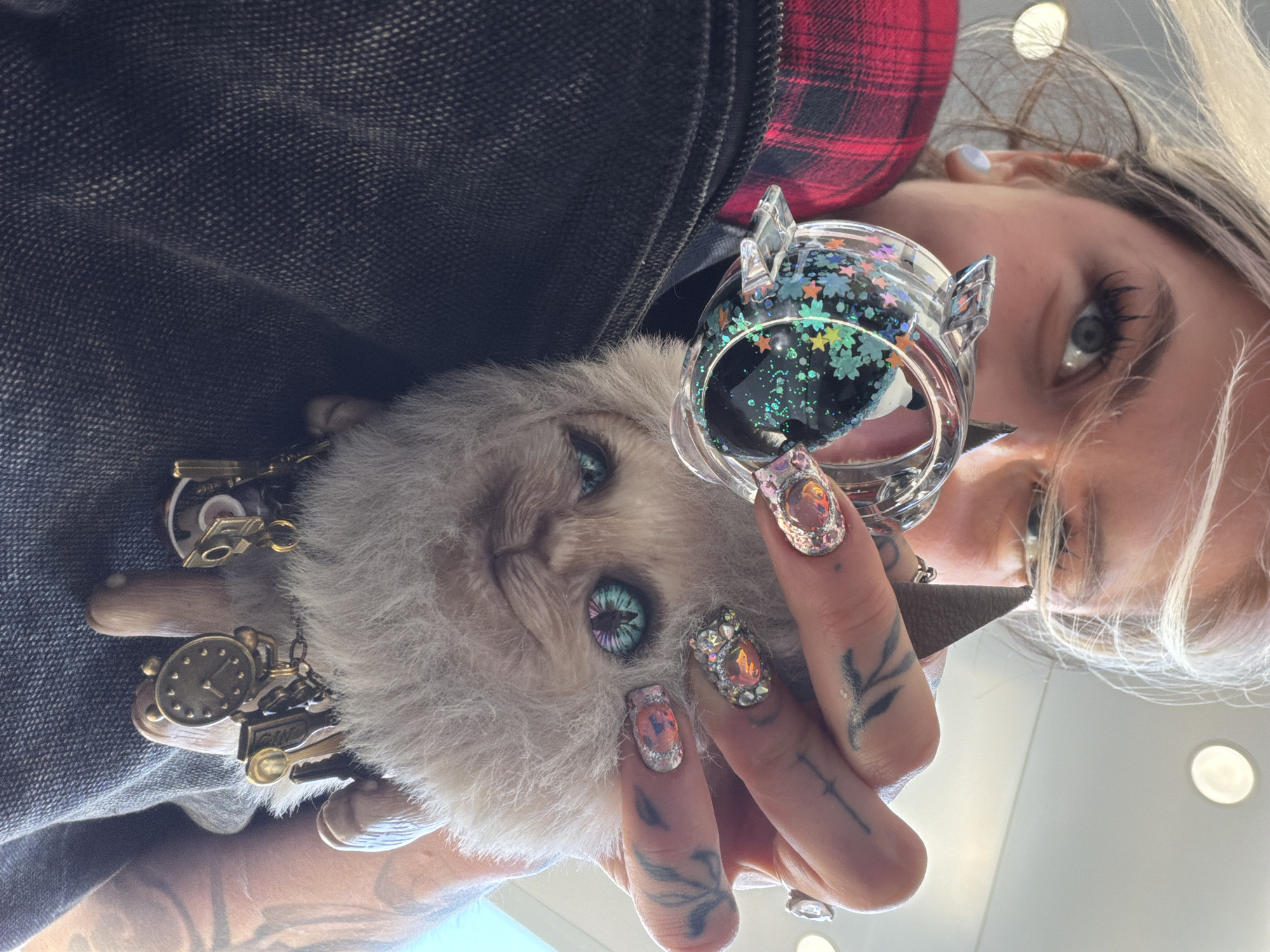 Woman holds cat plush toy in Montenegro village