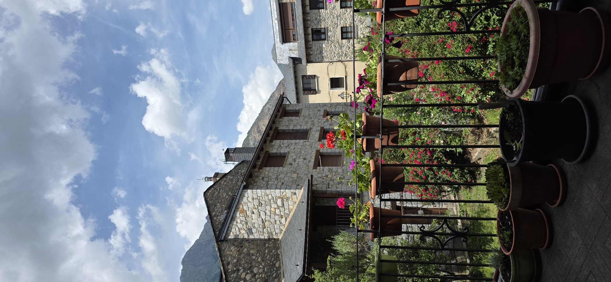 Stone buildings and blooming roses documented in Benasque village