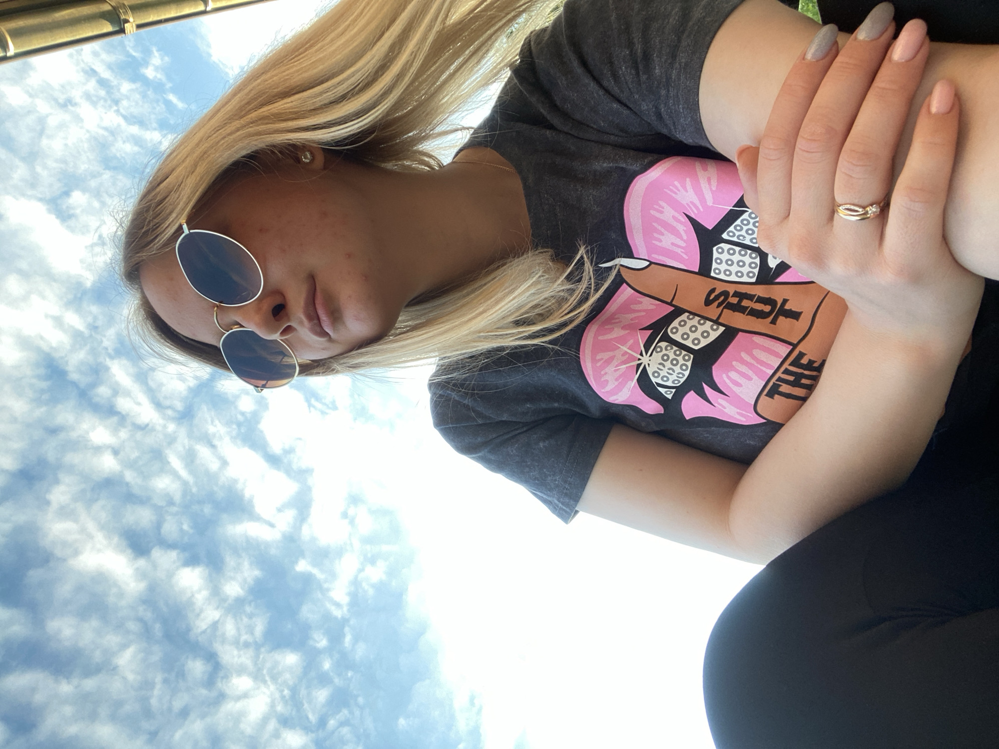 Woman documents afternoon outdoor moments through selfie photography session