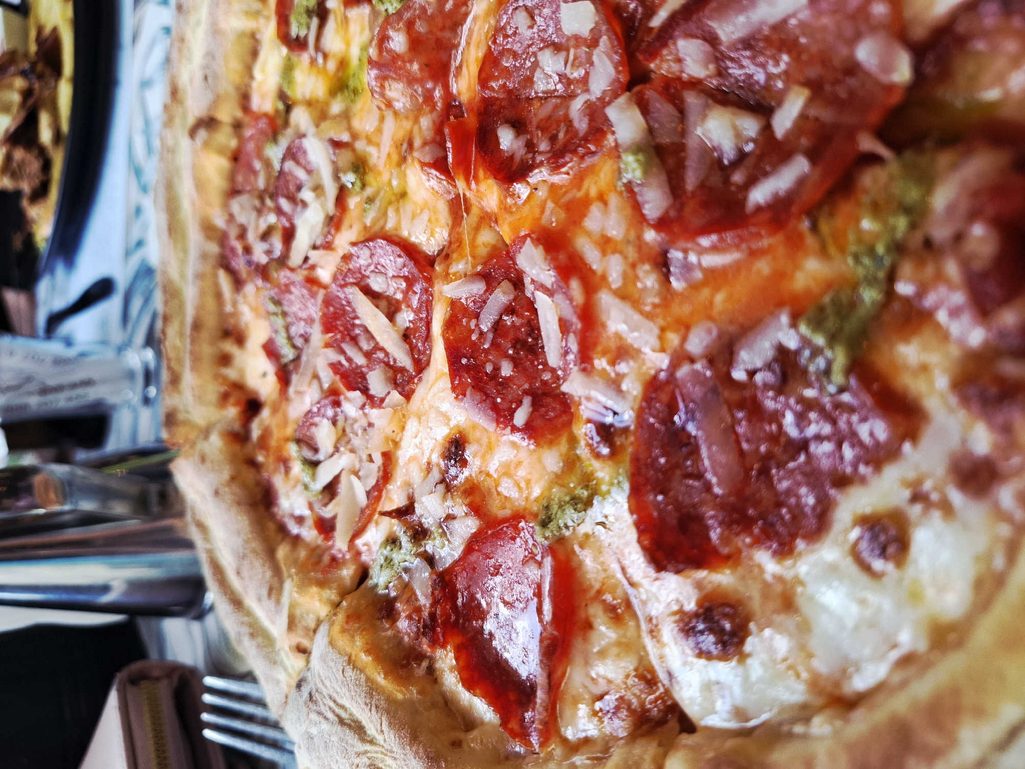 Pepperoni pesto pizza documented at unknown location