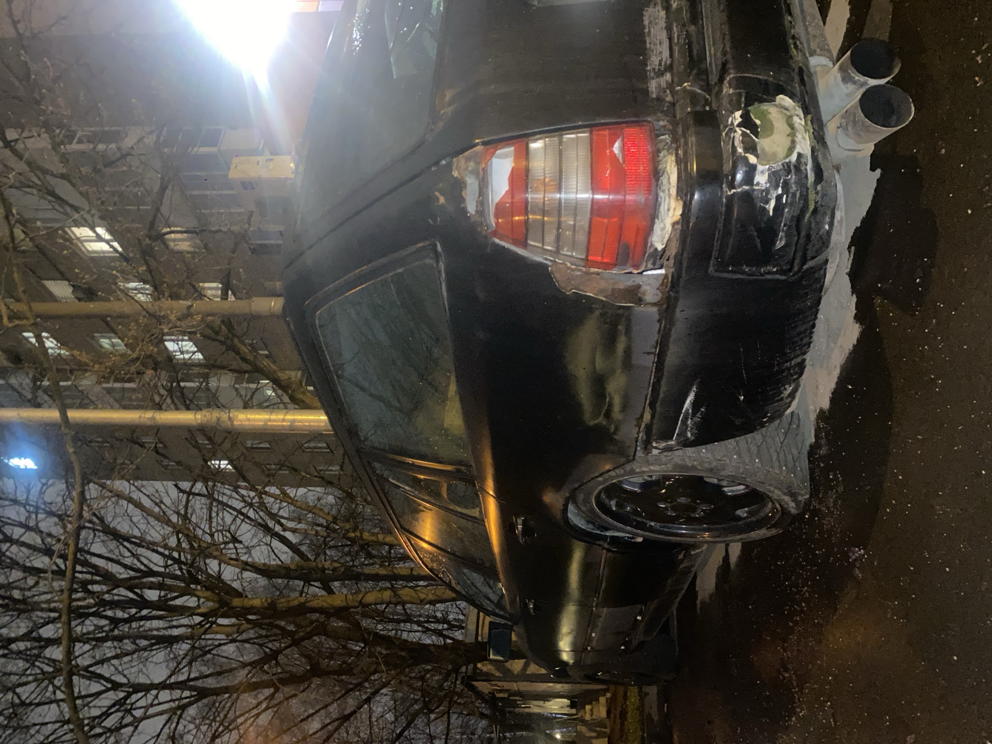 Damaged black car spotted parked on Moscow street