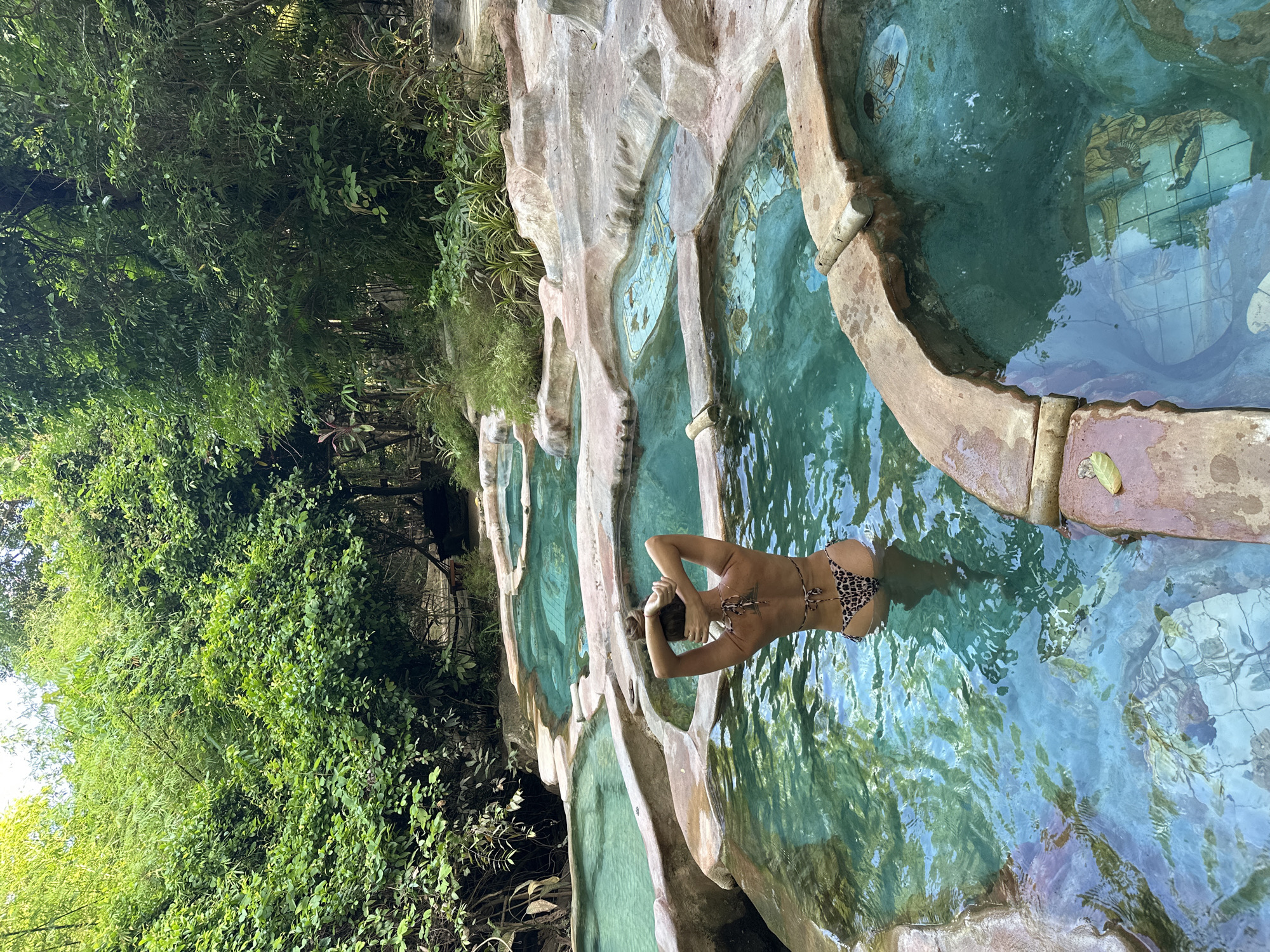 Soaking in Khlong Thom Nuea's natural turquoise hot springs