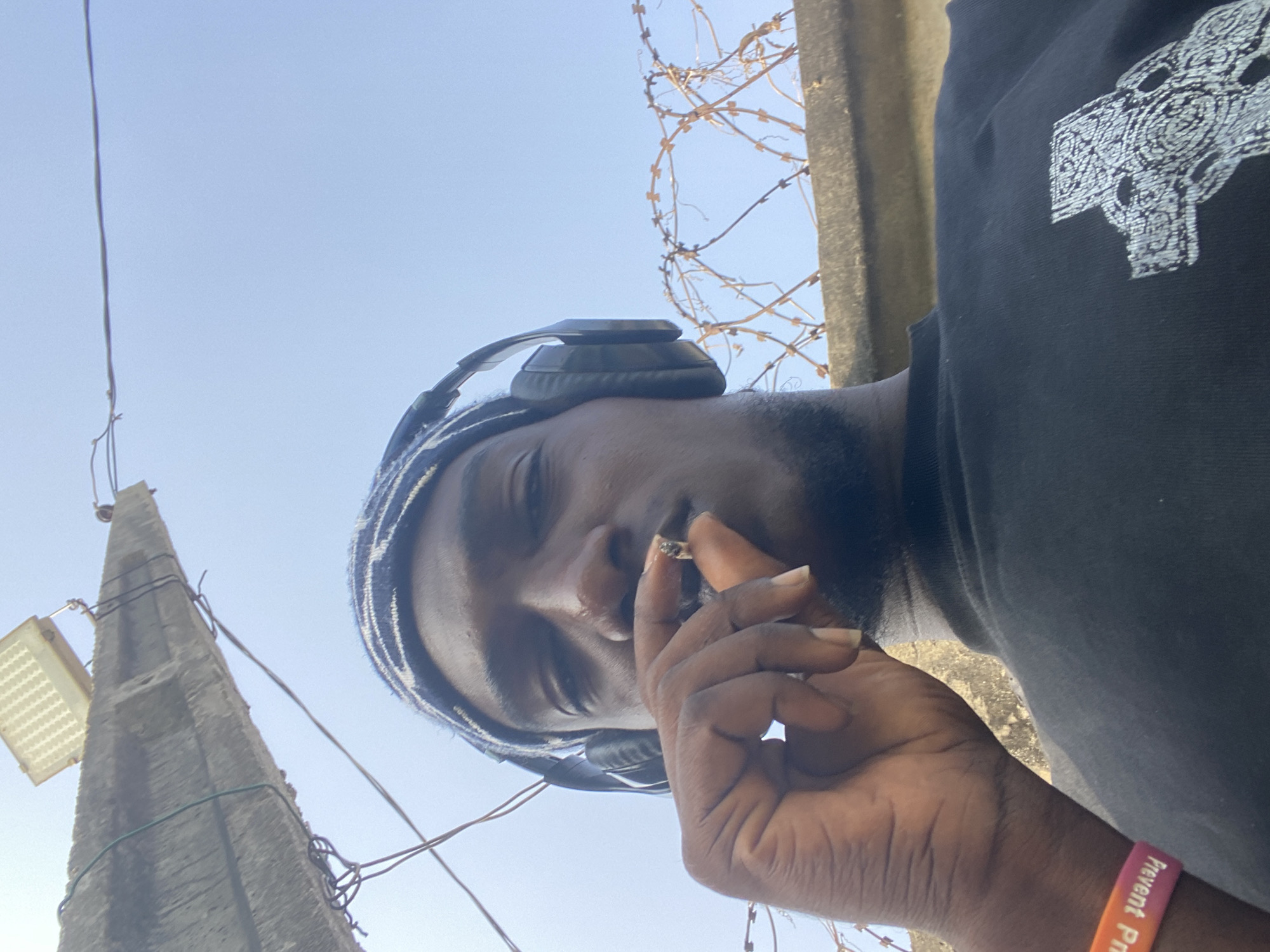 Person observed in grassy area near concrete structures Lagos
