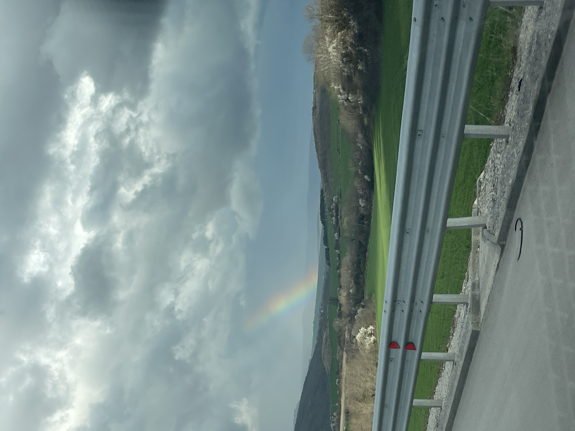 Rainbow appears over rural Bulgarian countryside near Buhovtsi