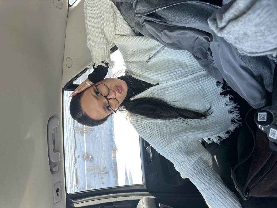 Two women travel by car through snowy Jraber, Armenia