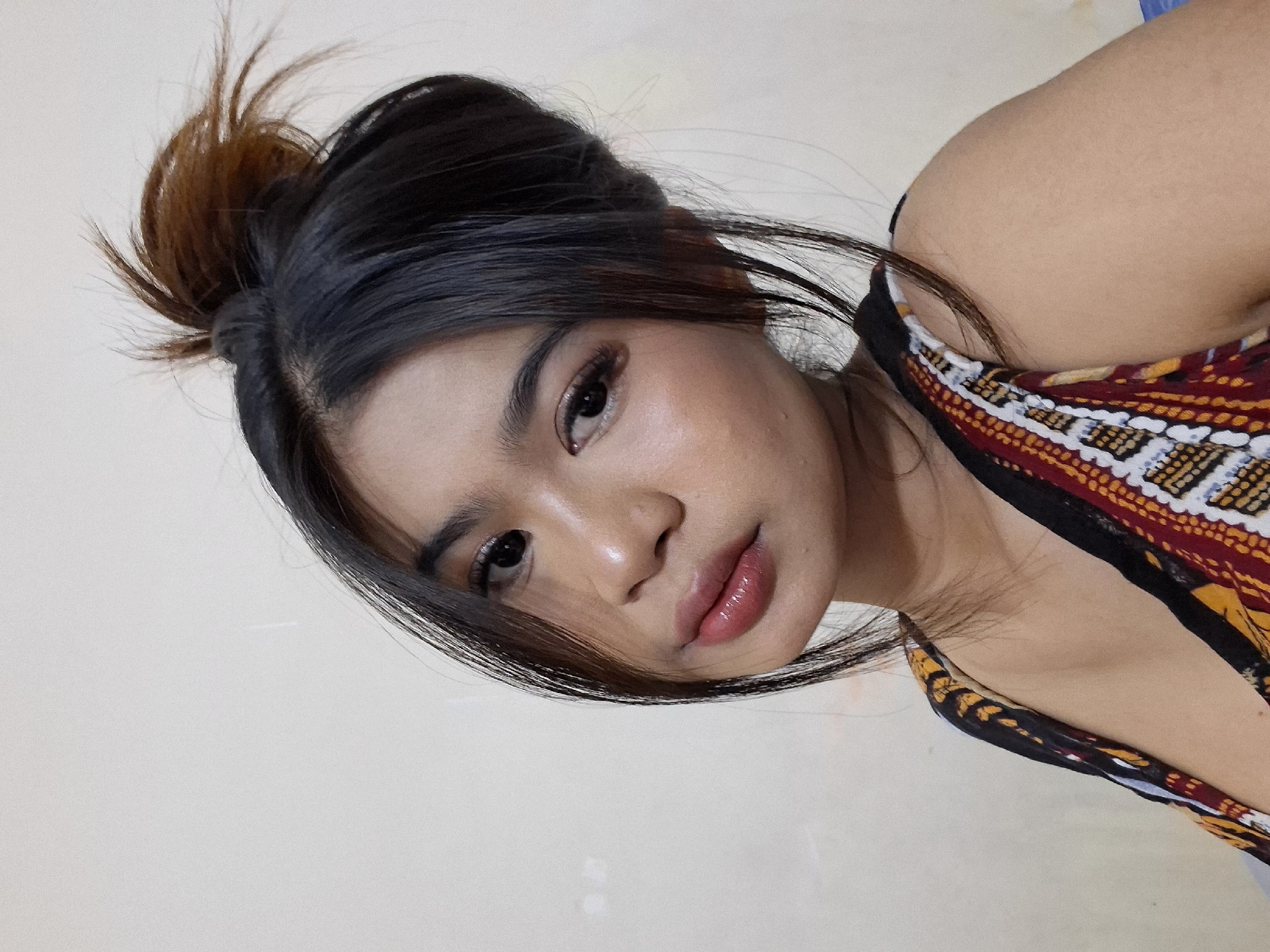Quick portrait session in Kuta, Bali — bold makeup, colorful top