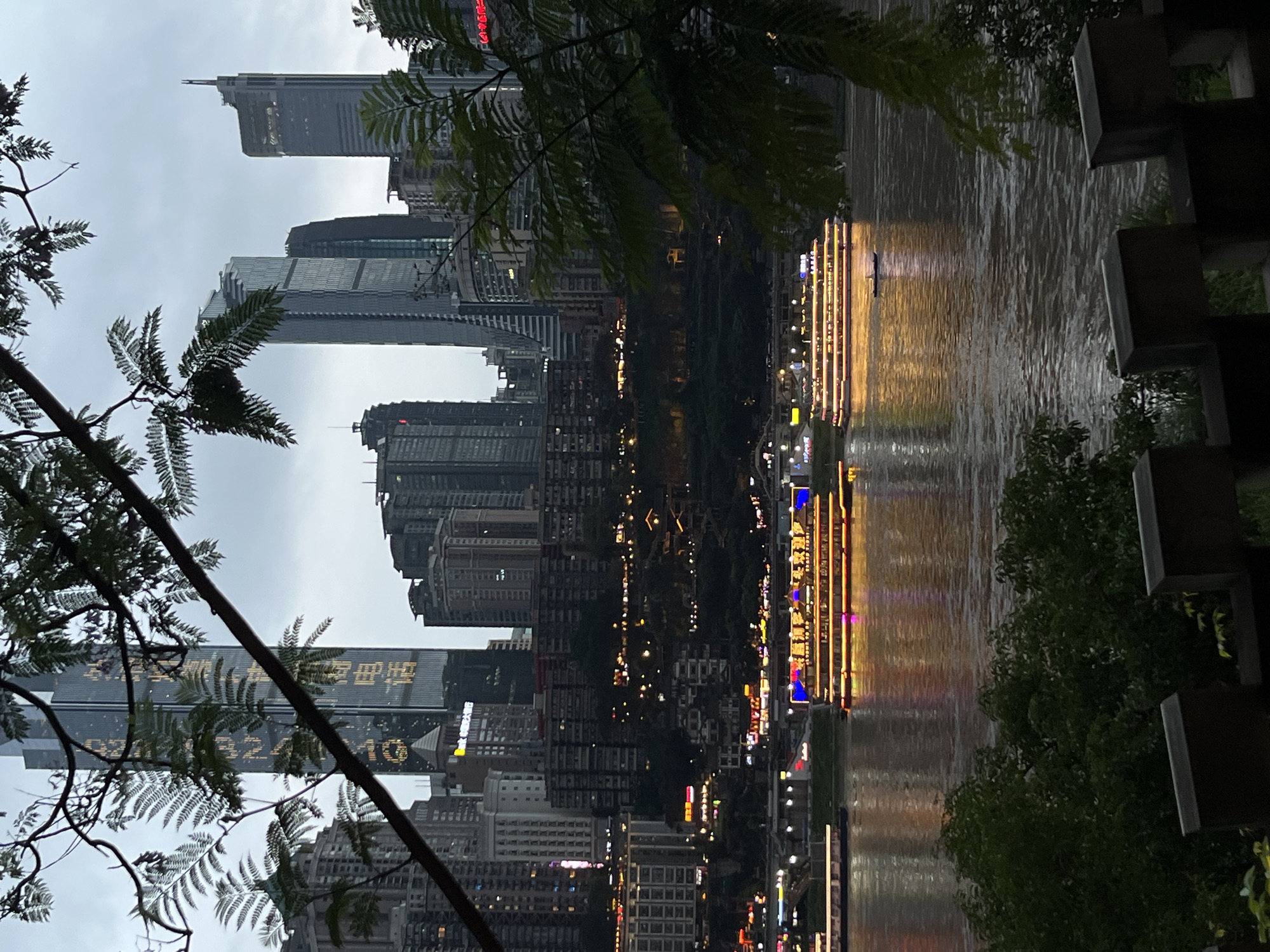 People gather at Chongqing riverside viewing areas during morning hours