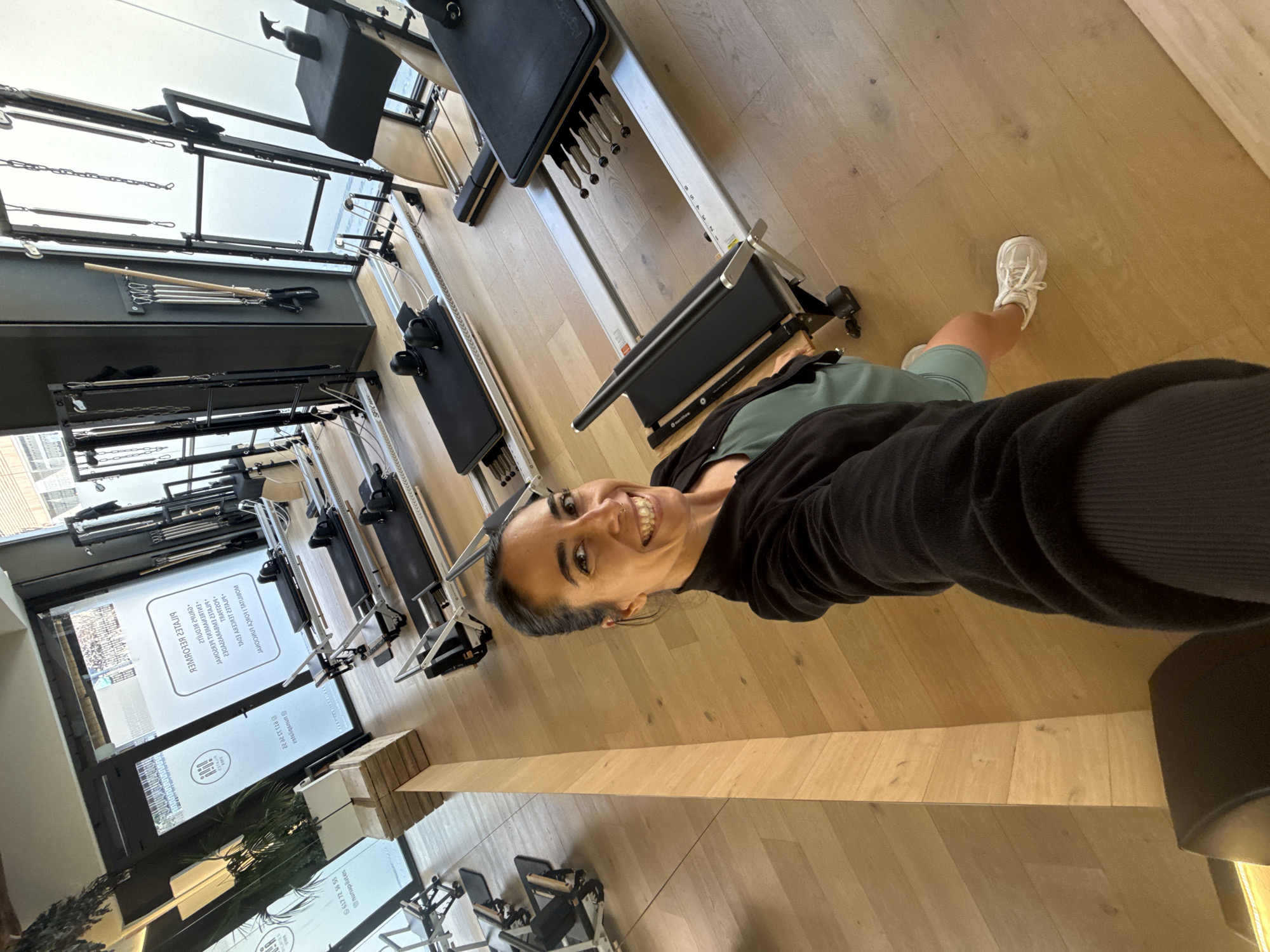 Inside a Barcelona Pilates studio, reformers lined up in rows