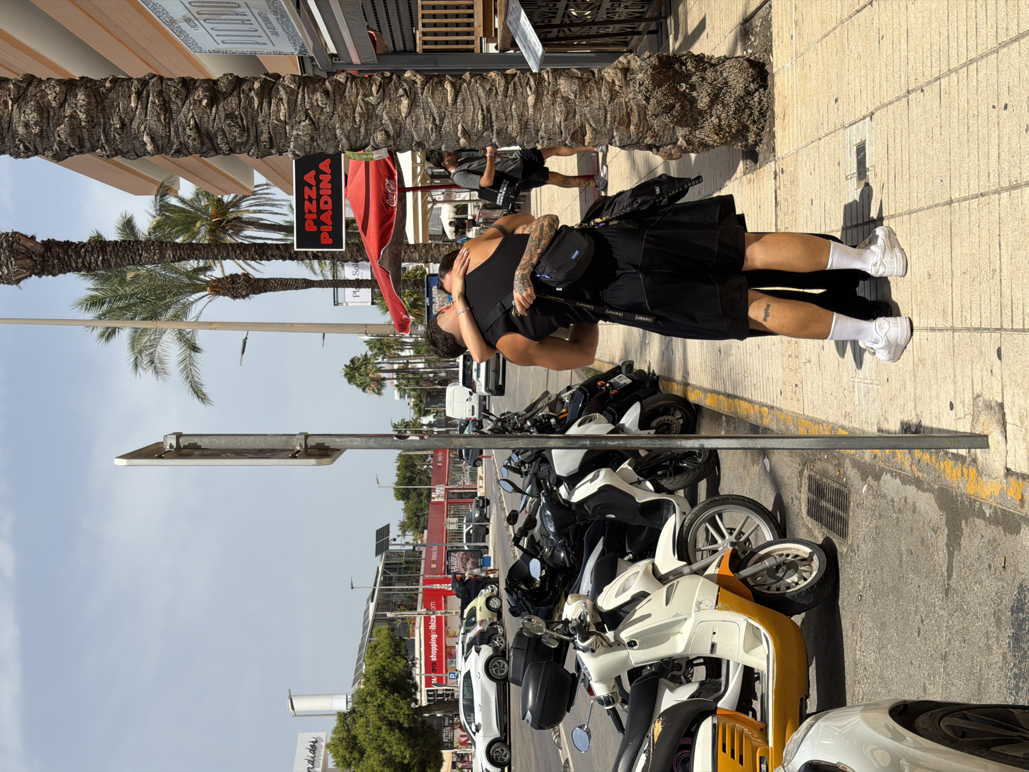 Busy afternoon along Ibiza's beach club and restaurant strip
