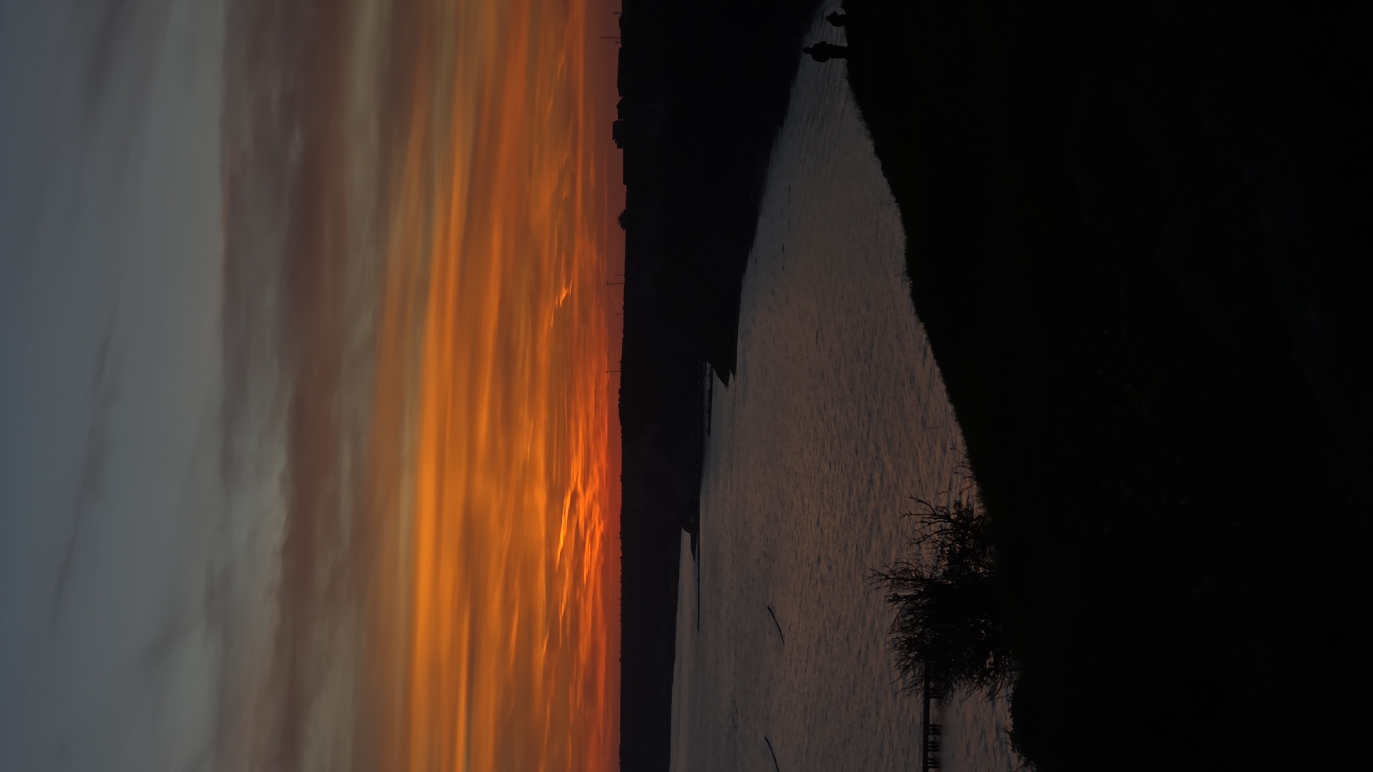 Fiery sunset photographed over water near Balgarevo, Bulgaria