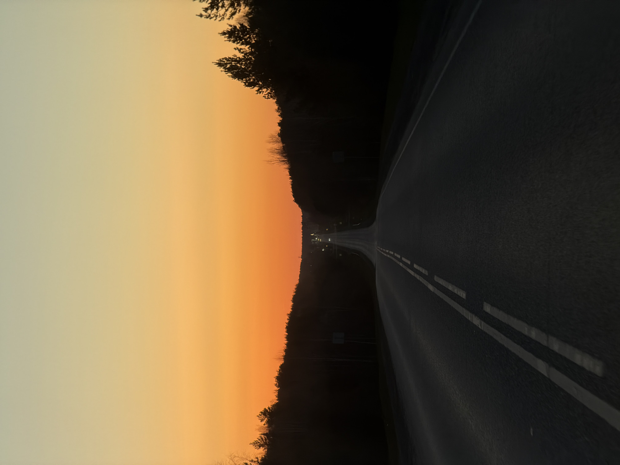 Sunset drive captured on curved road in Chaikovsky, Russia