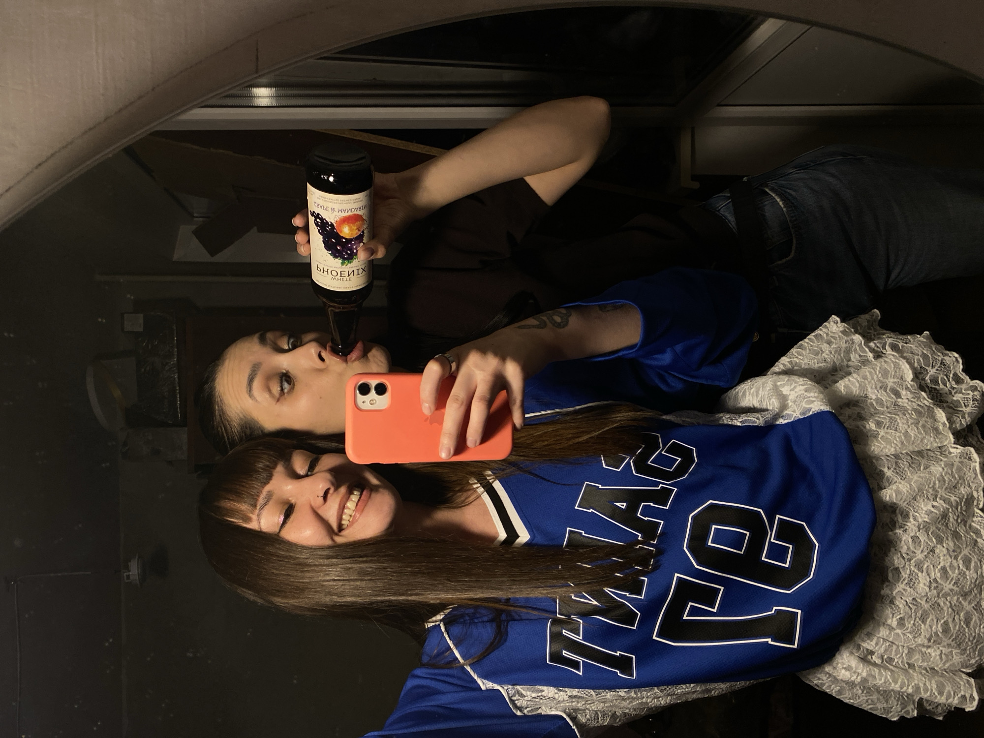 Two women take mirror selfies in Votkinsk, Russia