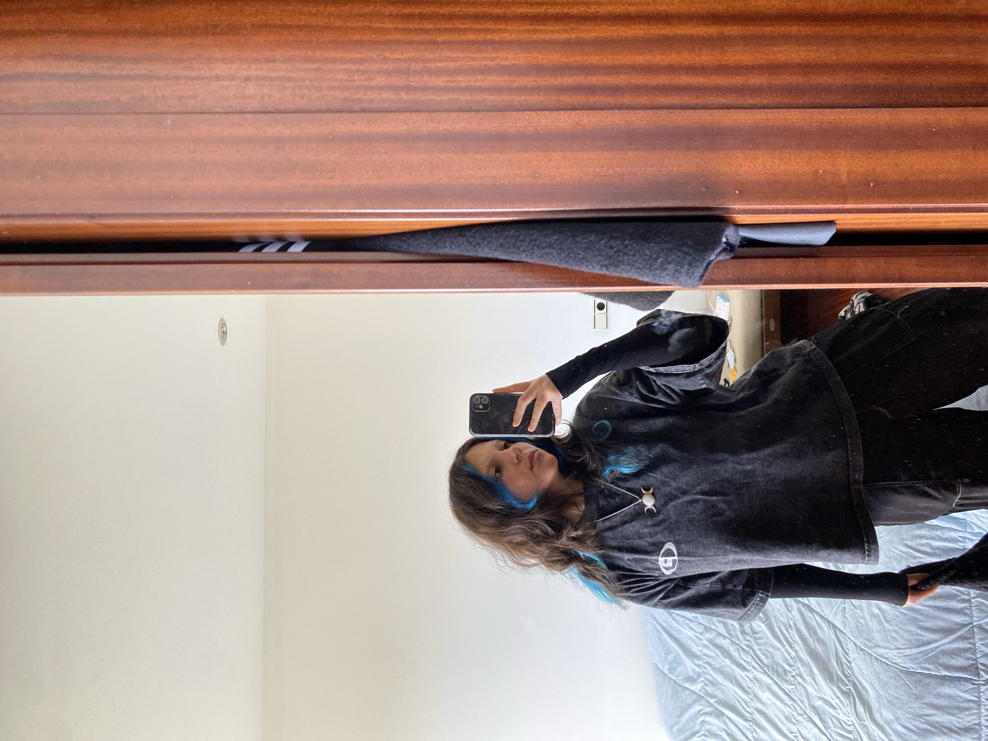 Woman takes mirror selfie in Gijón, Spain