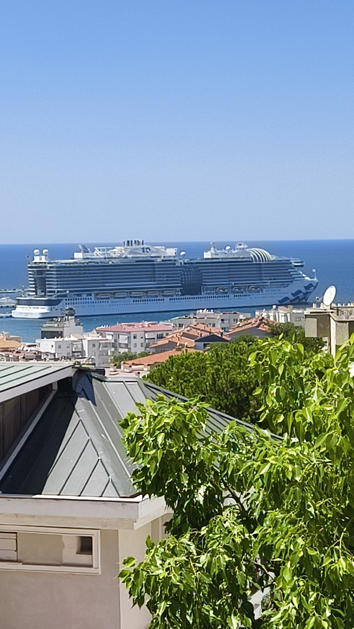 Massive cruise ship docked in sunny Kuşadası harbor