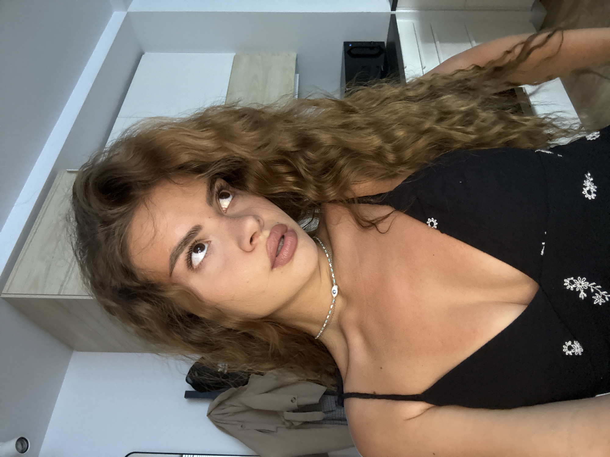 Woman documents morning routine through multiple indoor selfies