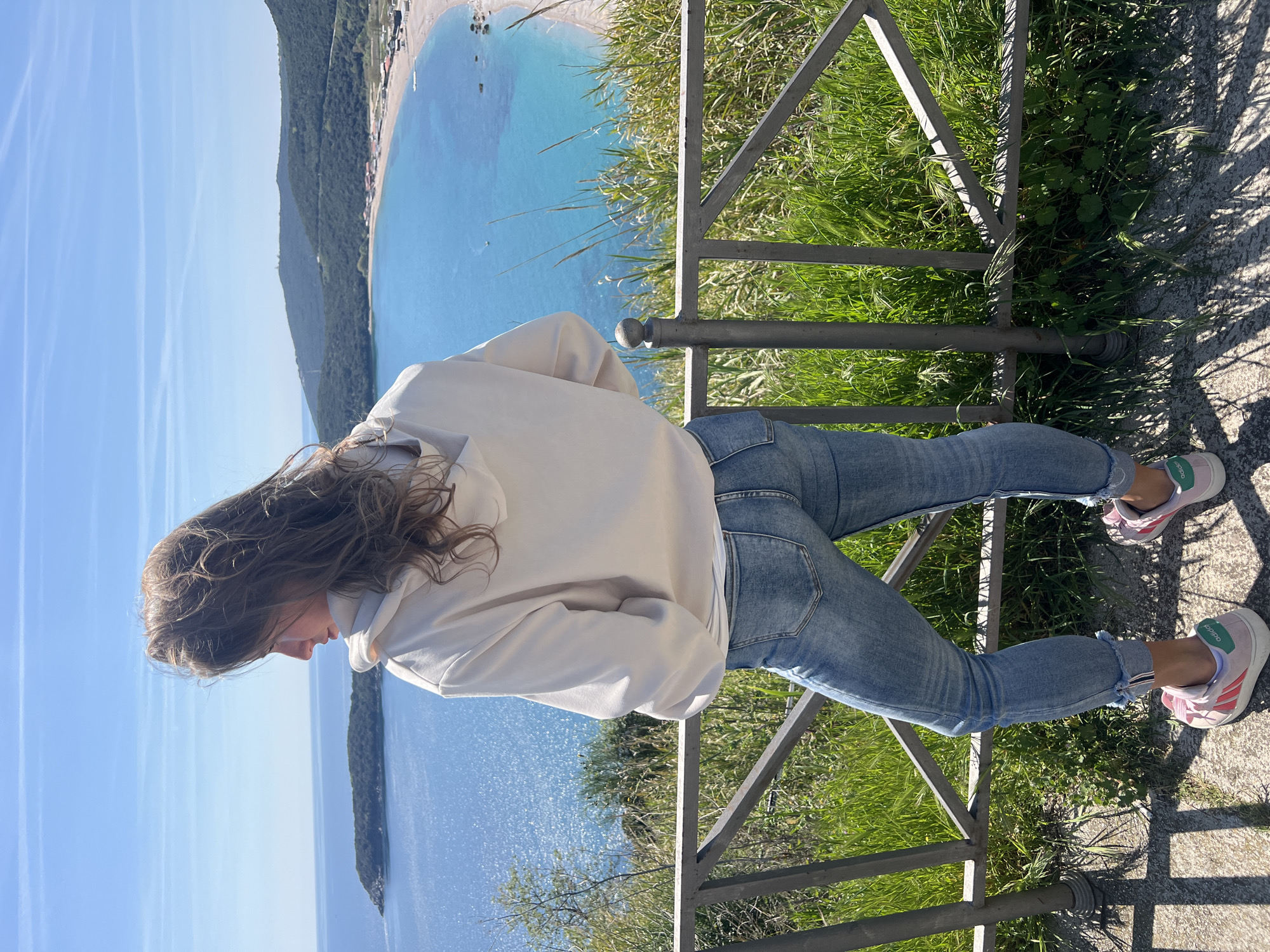 Woman enjoys coastal view in Prijevor, Montenegro bay area