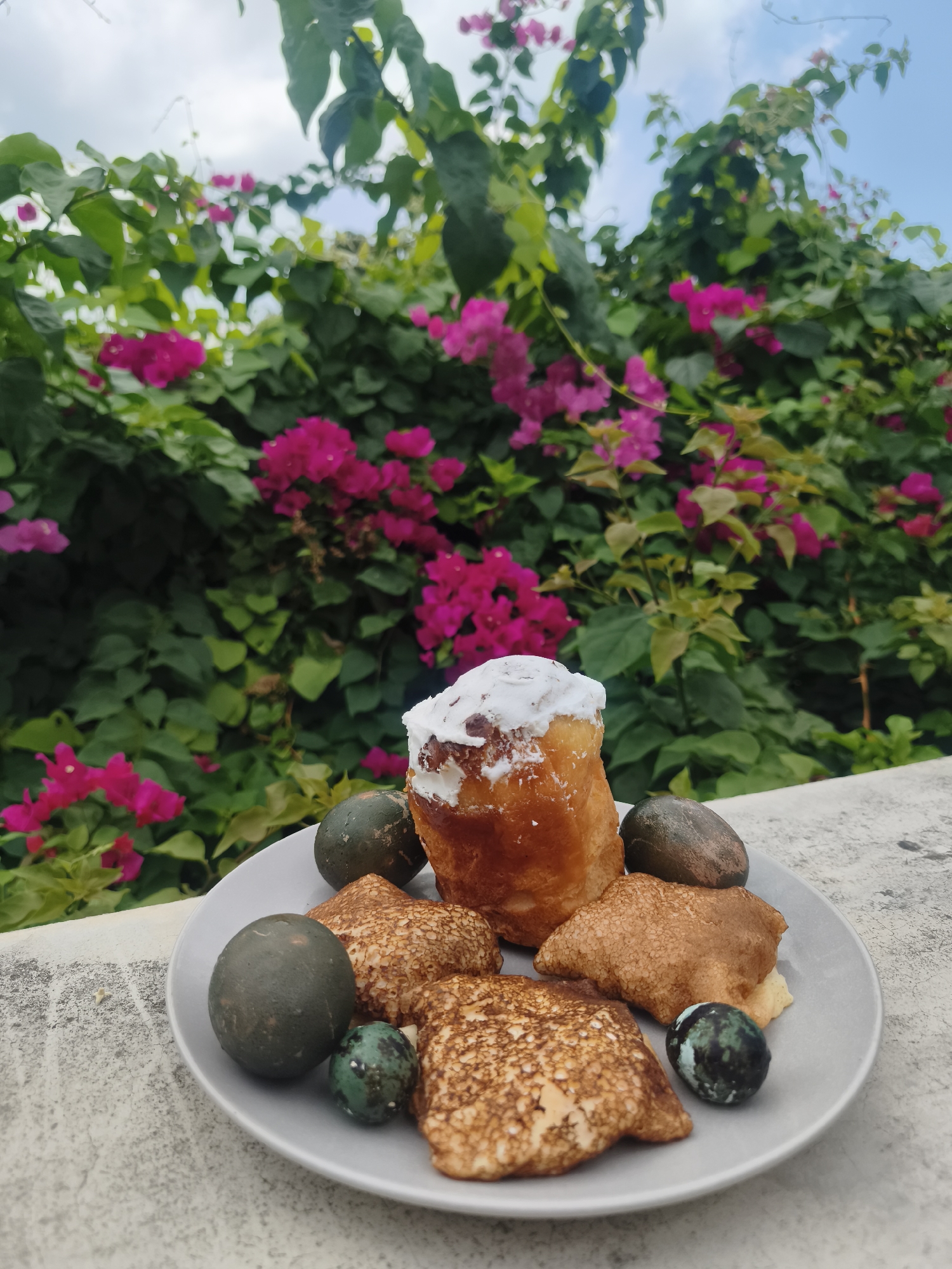 Morning meal photographed amid flowering bougainvillea in Ban Bang Rak